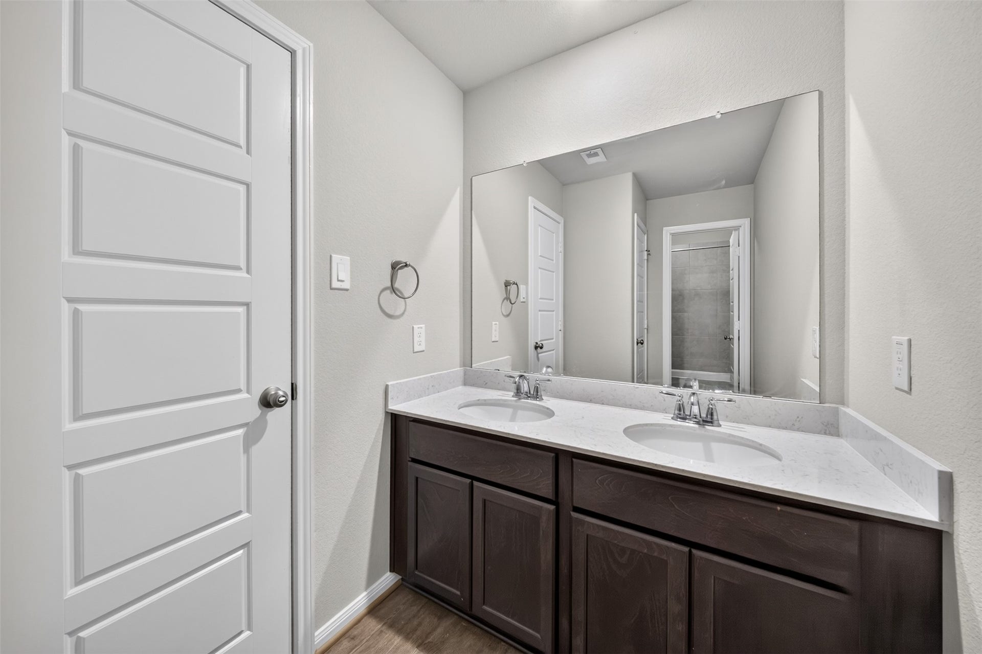 Bathroom 2 with double sinks and private bath area.