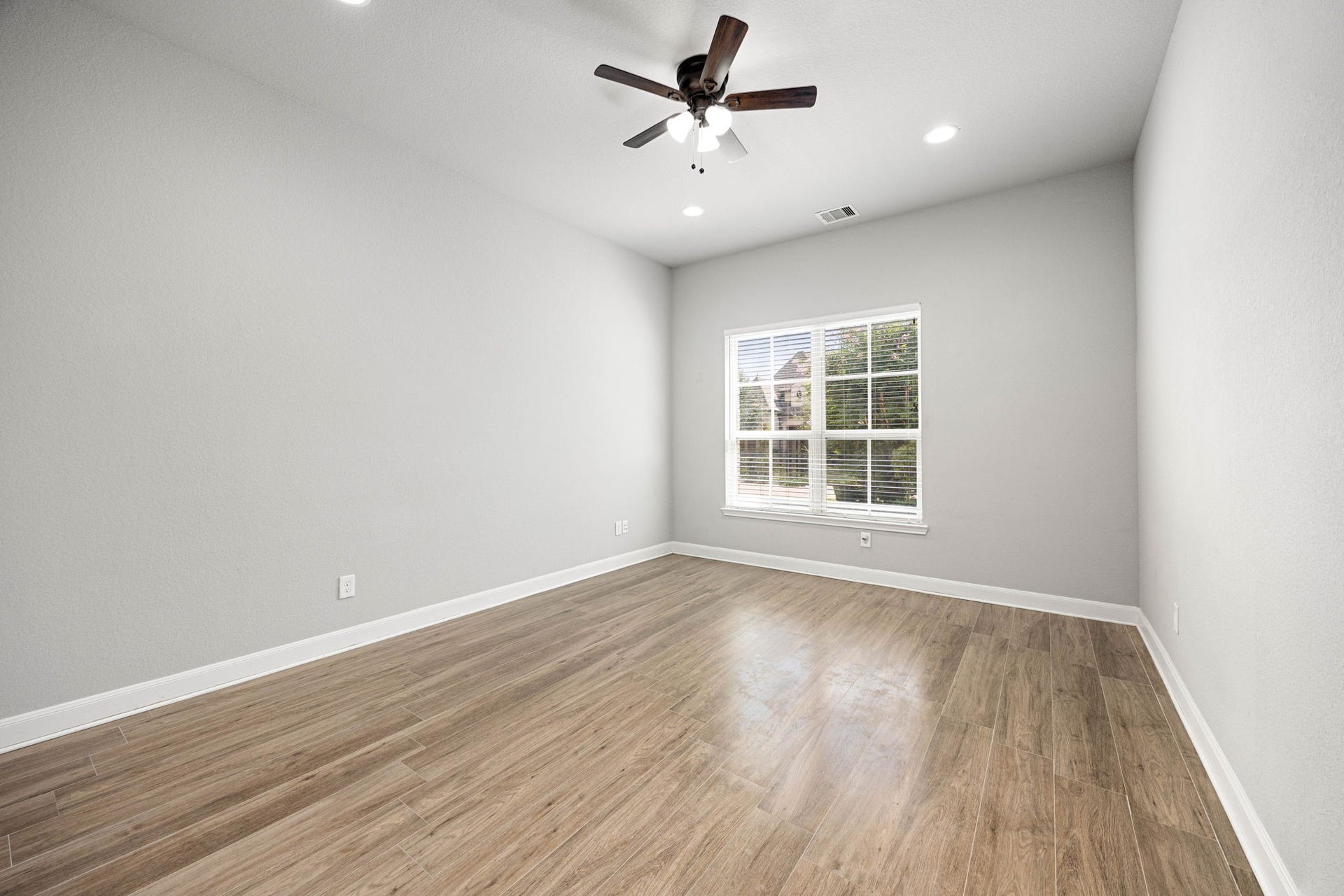 10606 Comeaux Lane, Richmond, TX 77407 Bright and inviting home office featuring a large window that fills the space with natural light.