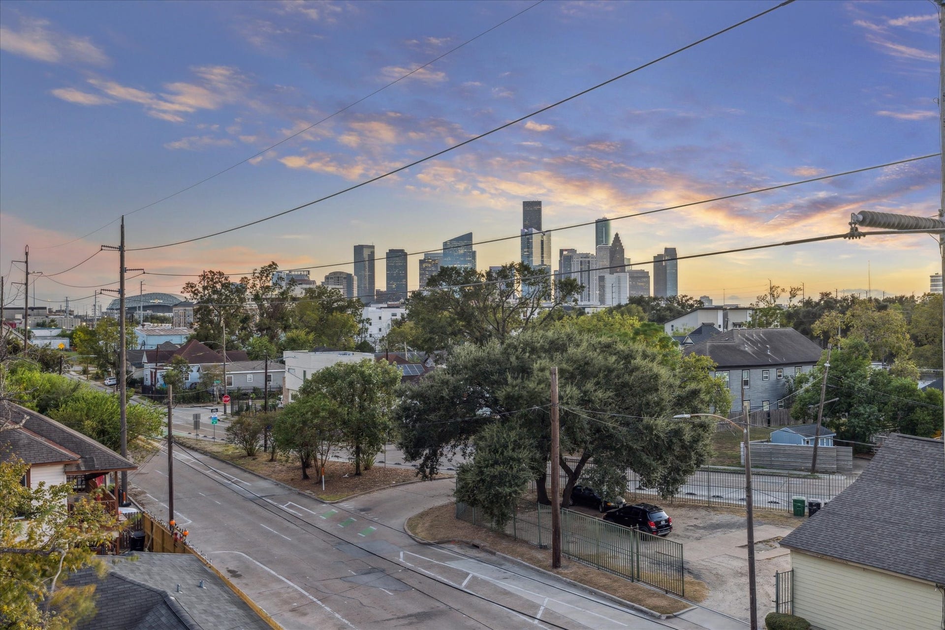 Enjoy stunning views of the city skyline from this charming neighborhood, offering a perfect blend of urban and suburban living.