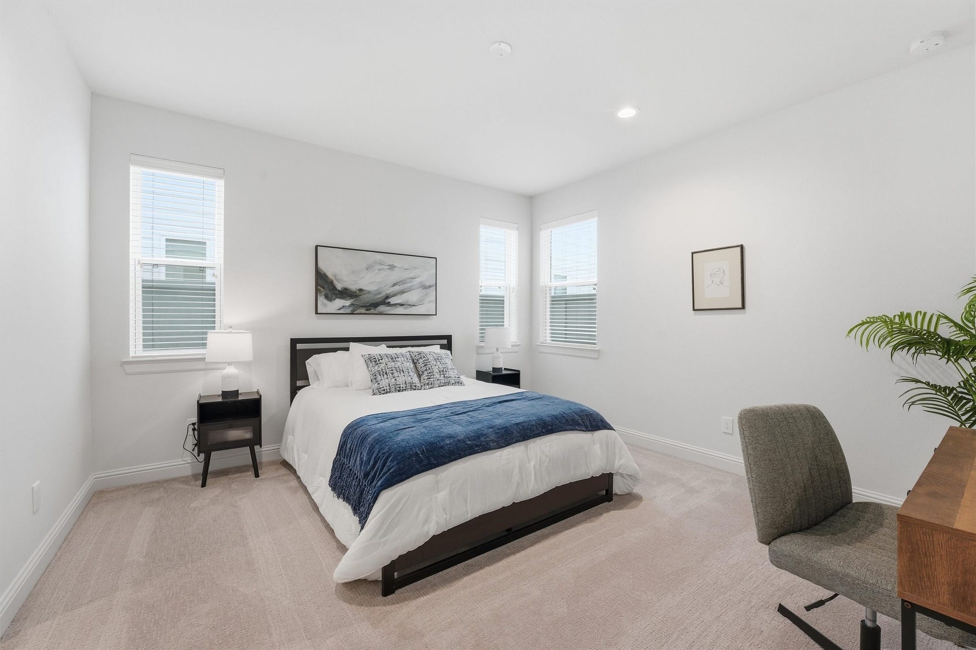 Discover ultimate comfort and style in this inviting guest suite, where abundant natural light, plush carpeting, and tasteful decor create a serene retreat.
