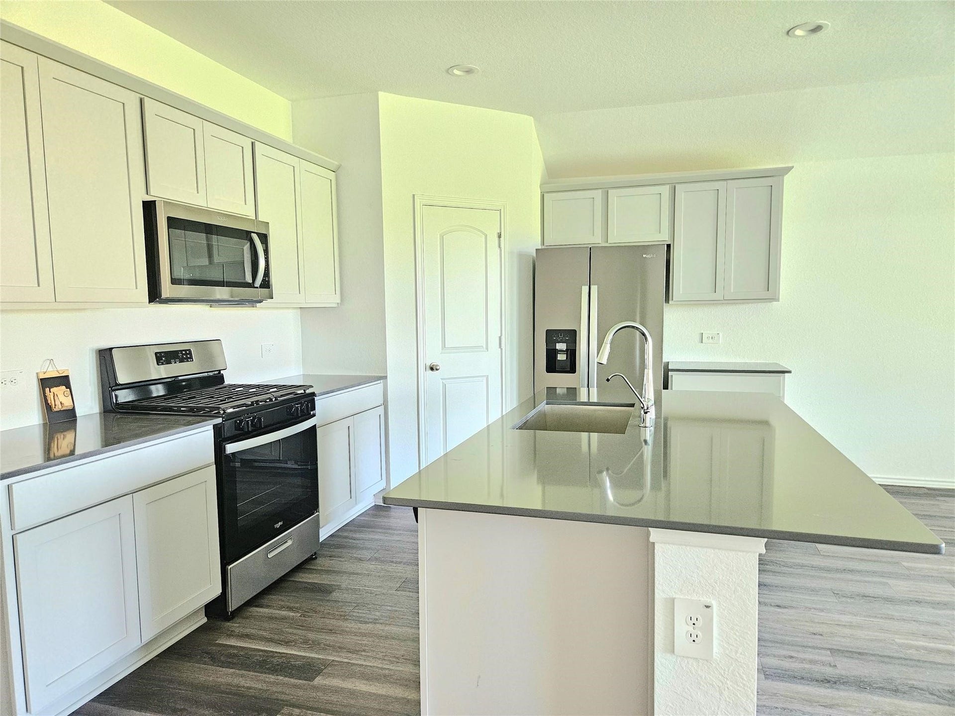 5029 Almond Terrace Drive, Katy, TX 77493 Kitchen with quartz countertops, stainless steel appliances and large island.
