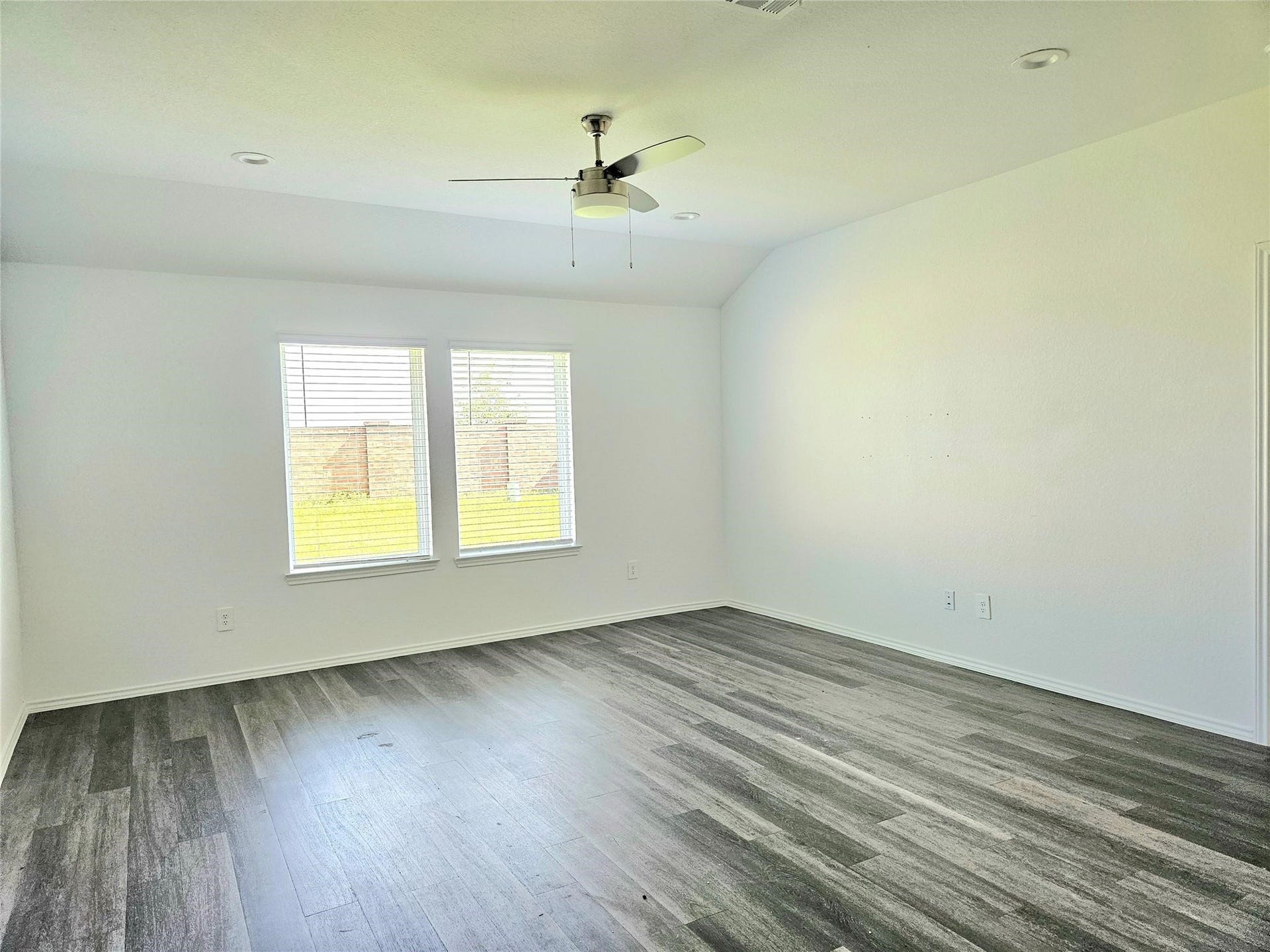 5029 Almond Terrace Drive, Katy, TX 77493 Family room with vinyl floors. Home has a lot of natural light throughout.