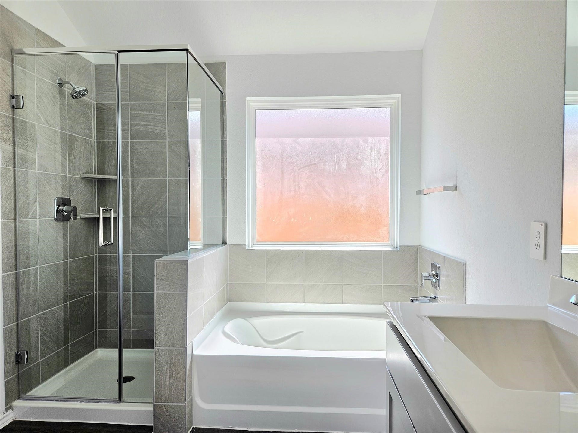 5029 Almond Terrace Drive, Katy, TX 77493 Primary bathroom with his and her sink, soaking tub and separate shower.