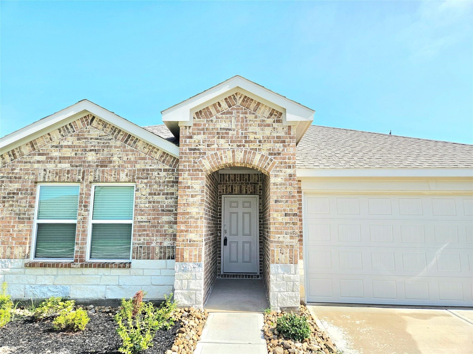 5029 Almond Terrace Drive, Katy, TX 77493 Elegant brick and stone elevation.