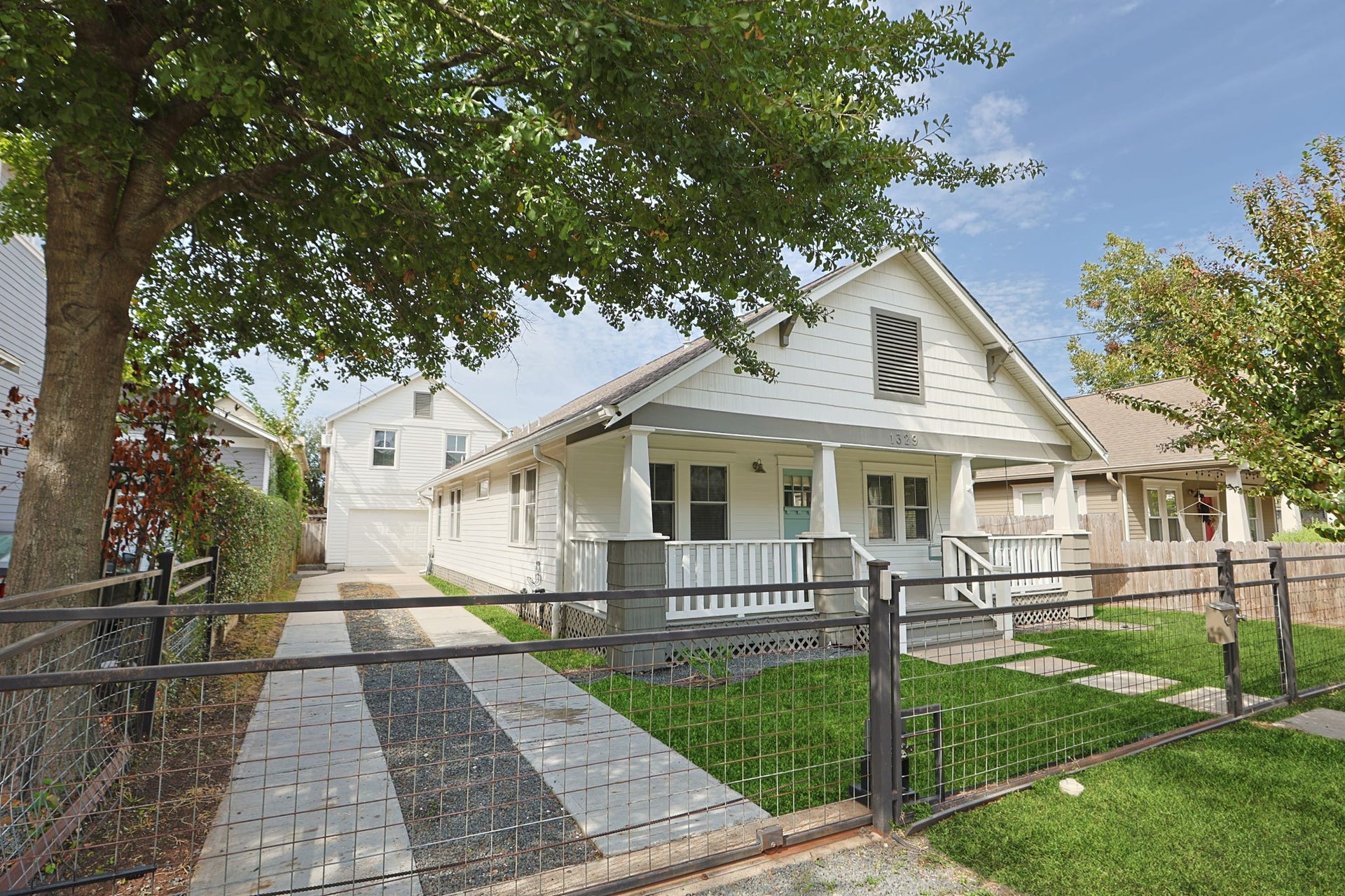 1329 Lawrence Street, Houston, TX 77008 Gated driveway leads to the garage apartment.
