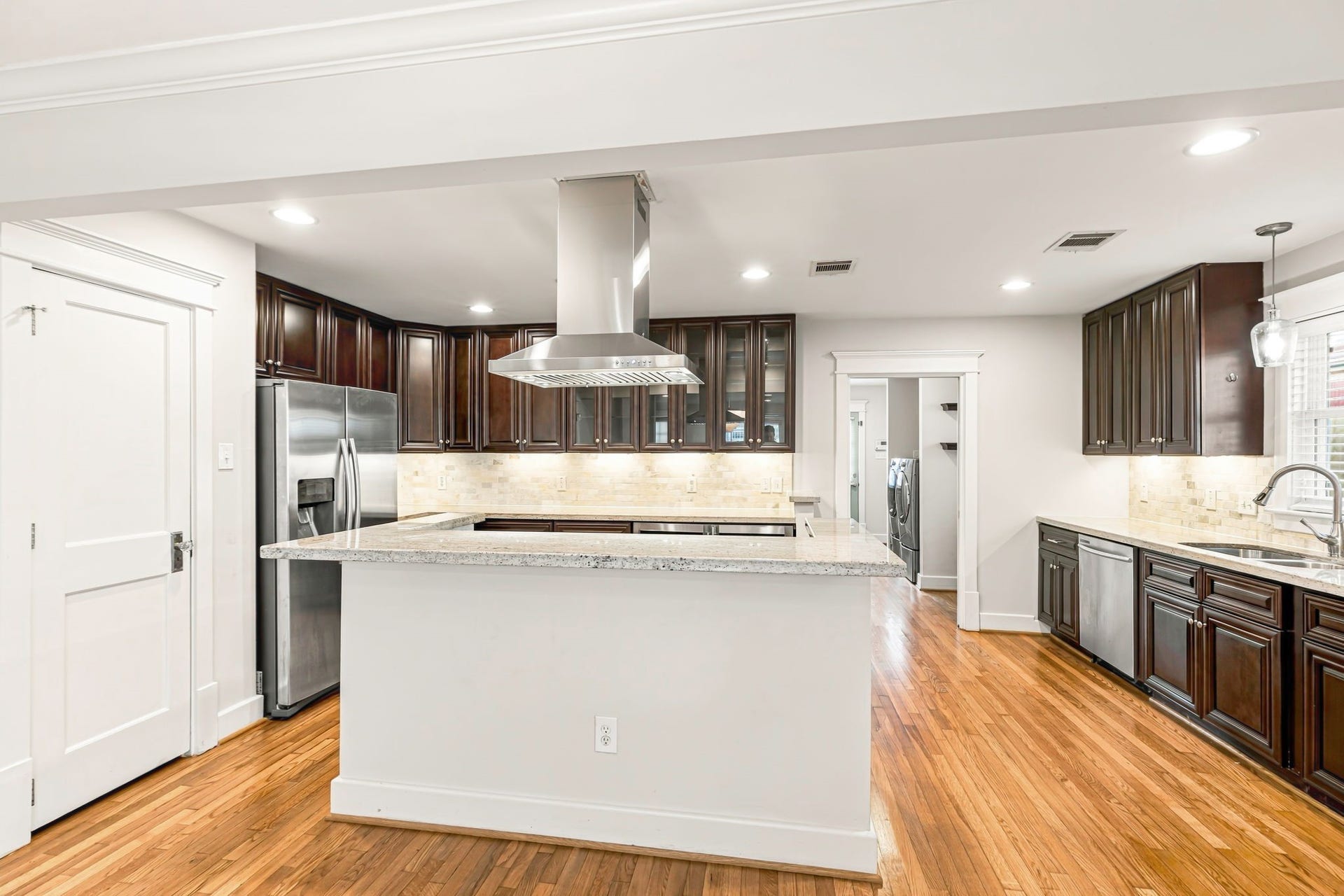 1329 Lawrence Street, Houston, TX 77008 Tons of cabinets and counter space plus and nice sized pantry. Recessed lighting and nice big windows make this home light and bright.