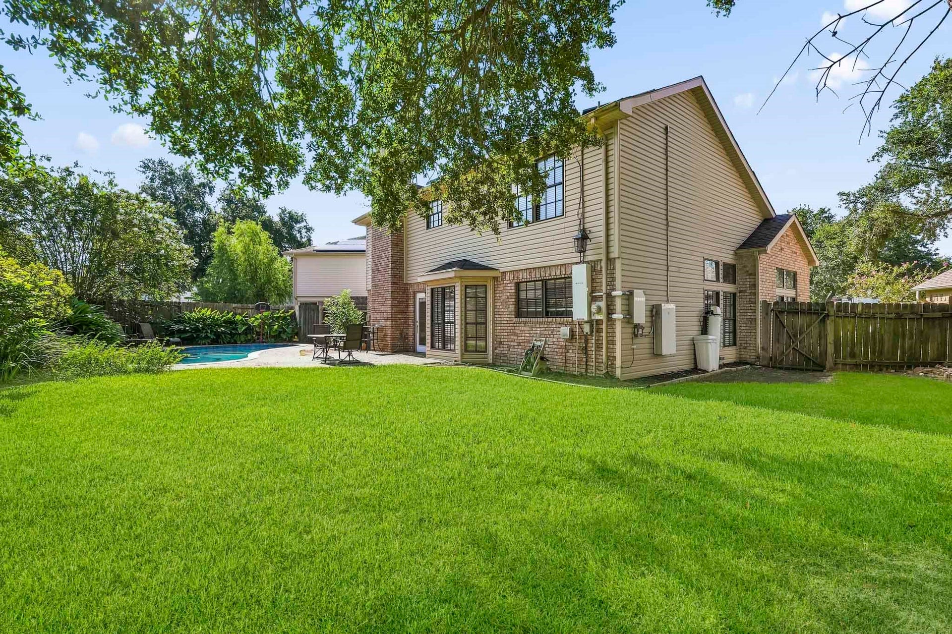 3311 Richmond Ferry Court, Richmond, TX 77406 The expansive lawn offers additional green space for relaxing, recreation, or gatherings.