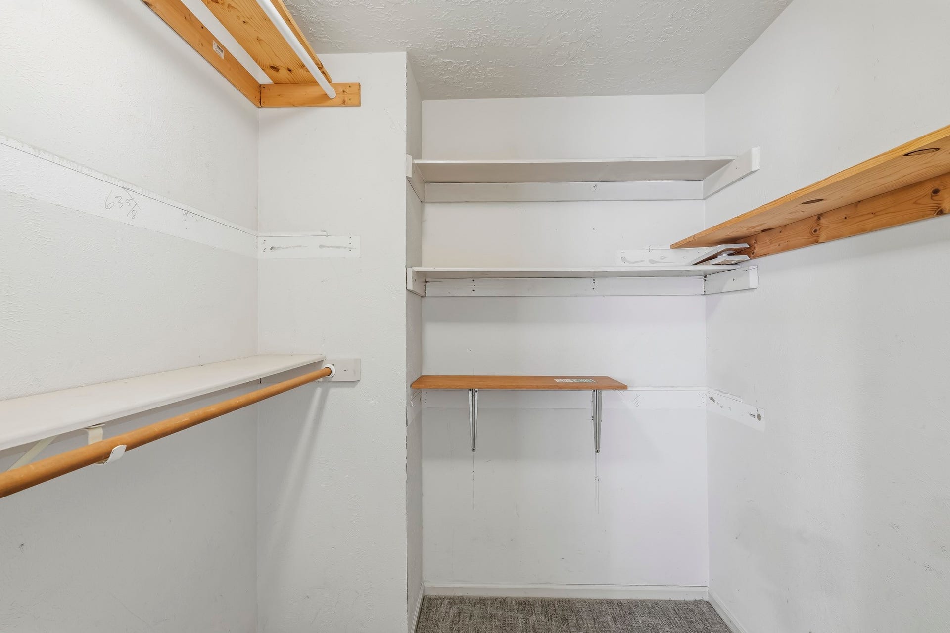 3311 Richmond Ferry Court, Richmond, TX 77406 One of two master closets. The generous layout provides plenty of room to organize clothing, shoes, and accessories while keeping everything easily accessible.