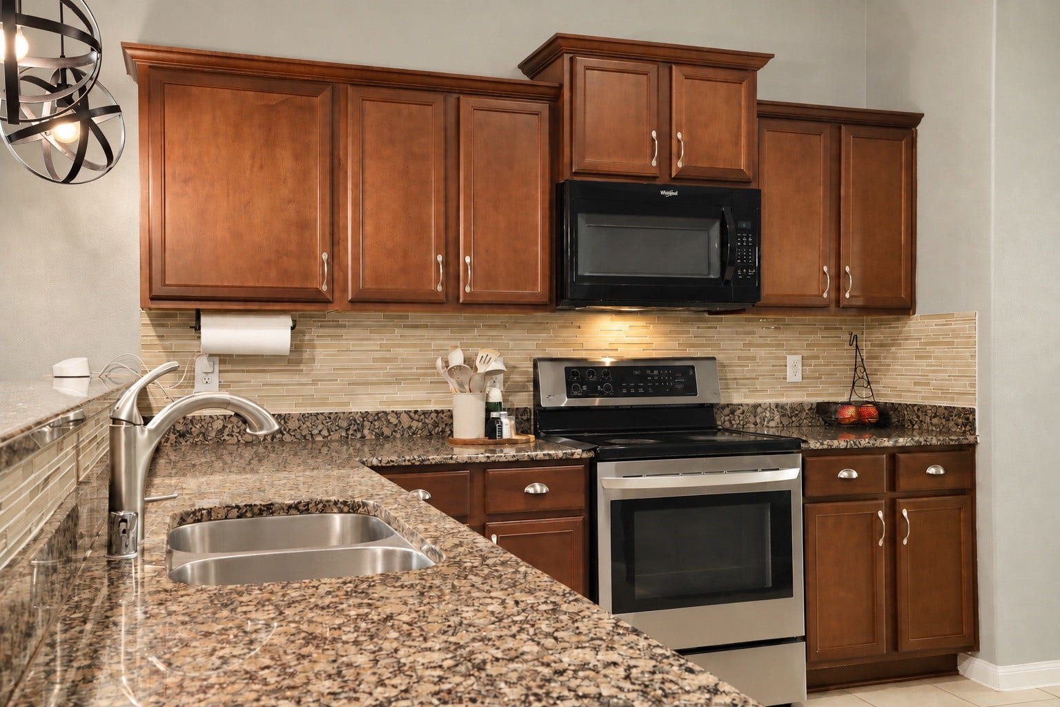 1634 Pink Stone Drive, Rosharon, TX 77583 Great space in the kitchen with a breakfast bar , granite countertops and electric stove.
