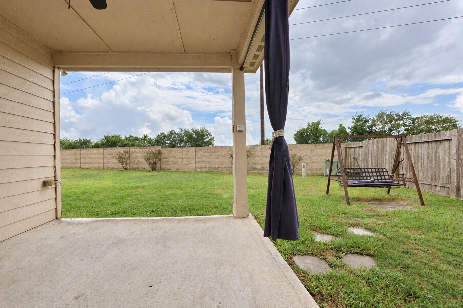 1634 Pink Stone Drive, Rosharon, TX 77583 One if the nicer features of this home is the covered patio, situated at a corner angle so you can make room for a playground or a future pool!