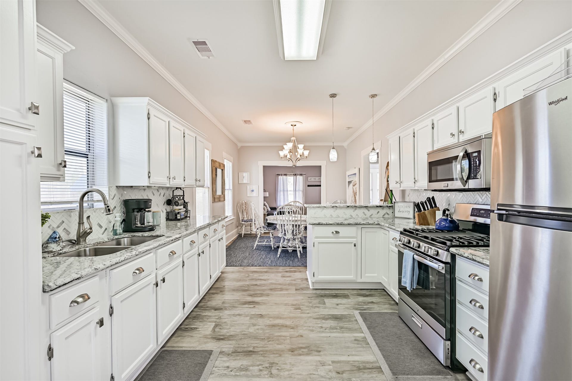 1419 39th Street, Galveston, TX 77550 An Additional Shot for Layout Perspective Between the Kitchen, Dining and Living Rooms! Nice Flooring was Recently Installed as Well!