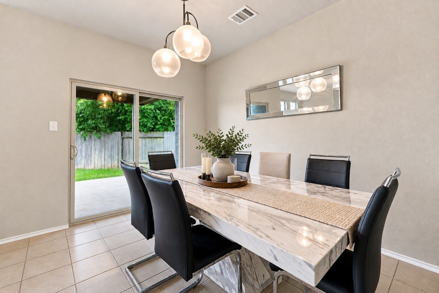 2307 Northern Great White Court, Katy, TX 77449 Virtually Staged: This angle captures the dining rooms seamless connection to the outdoor patio and nearby hallway.