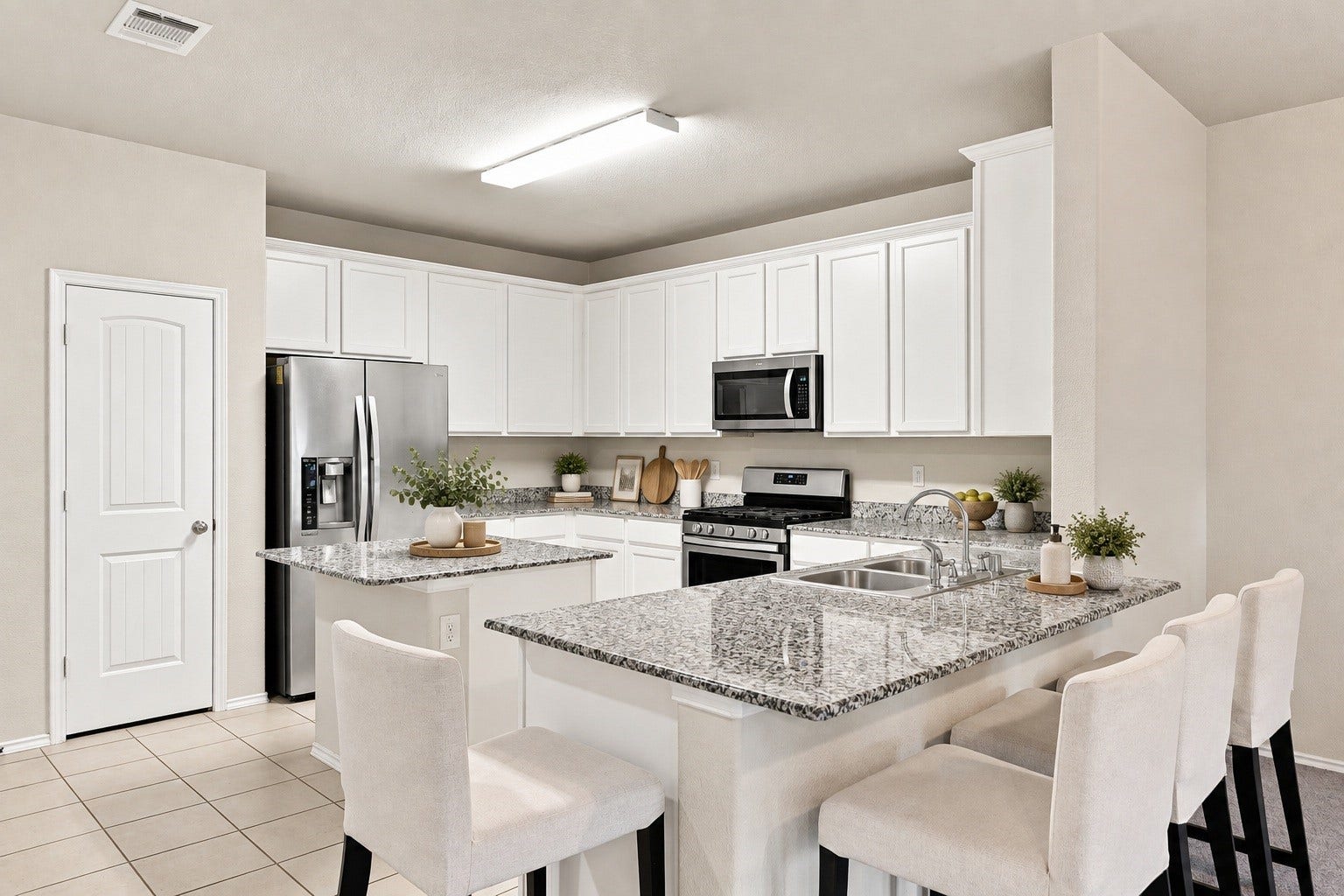 2307 Northern Great White Court, Katy, TX 77449 Designed for efficient meal prep, this kitchen offers multi-level counter space, including a central island and an extended breakfast bar.