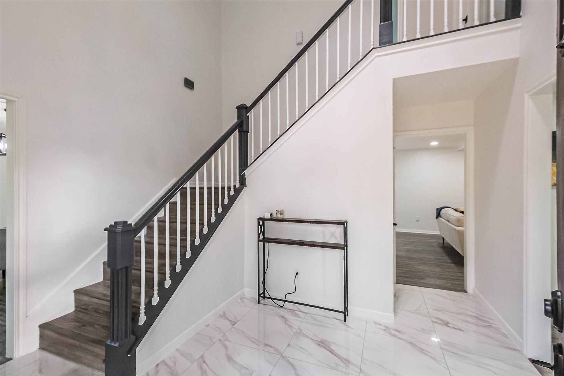 4023 Laverock Road, Spring, TX 77388 Really lovely hallway with high ceilings, designer light fixture and new floor tiles.