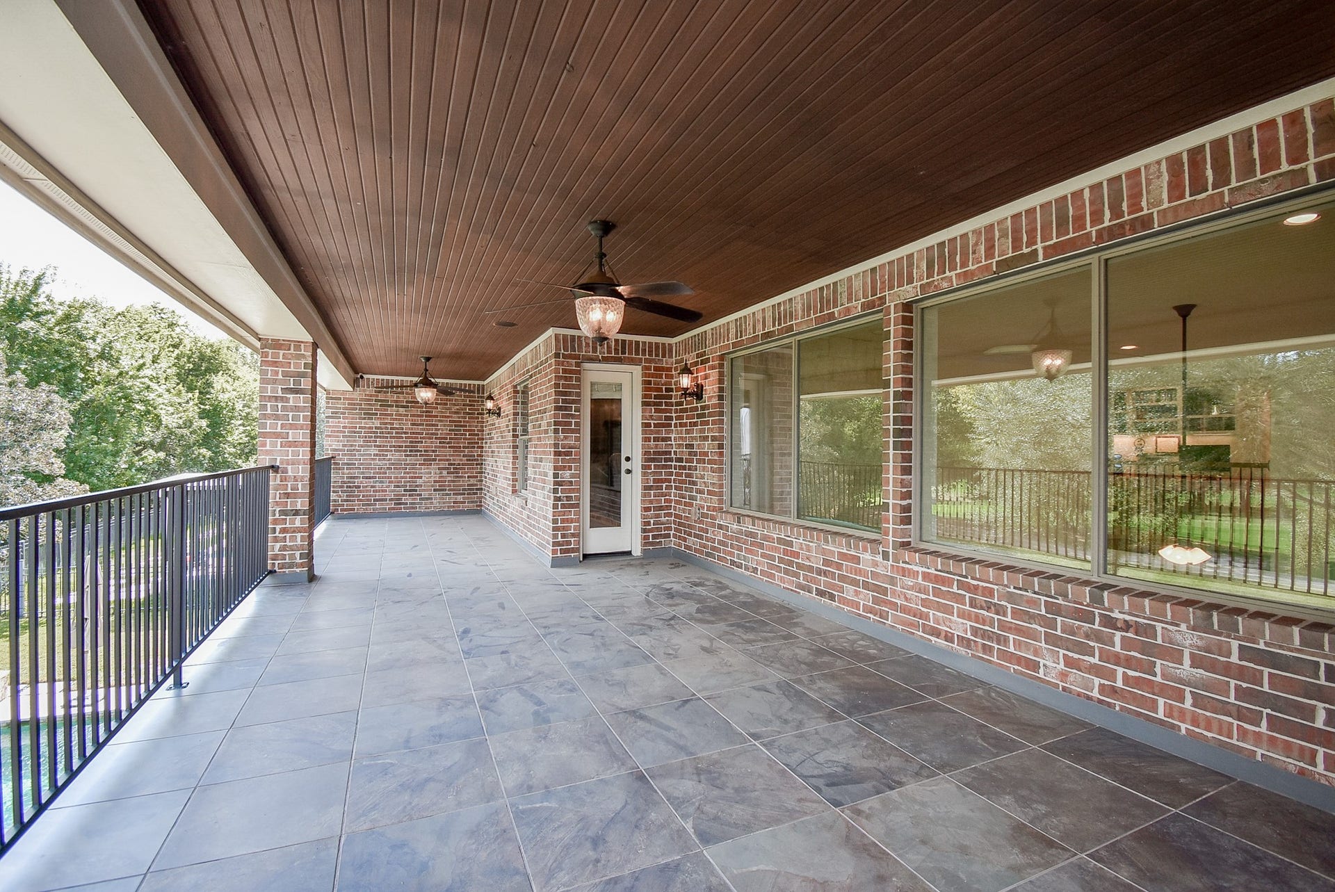 Second view of the covered balcony showing access to bedroom three