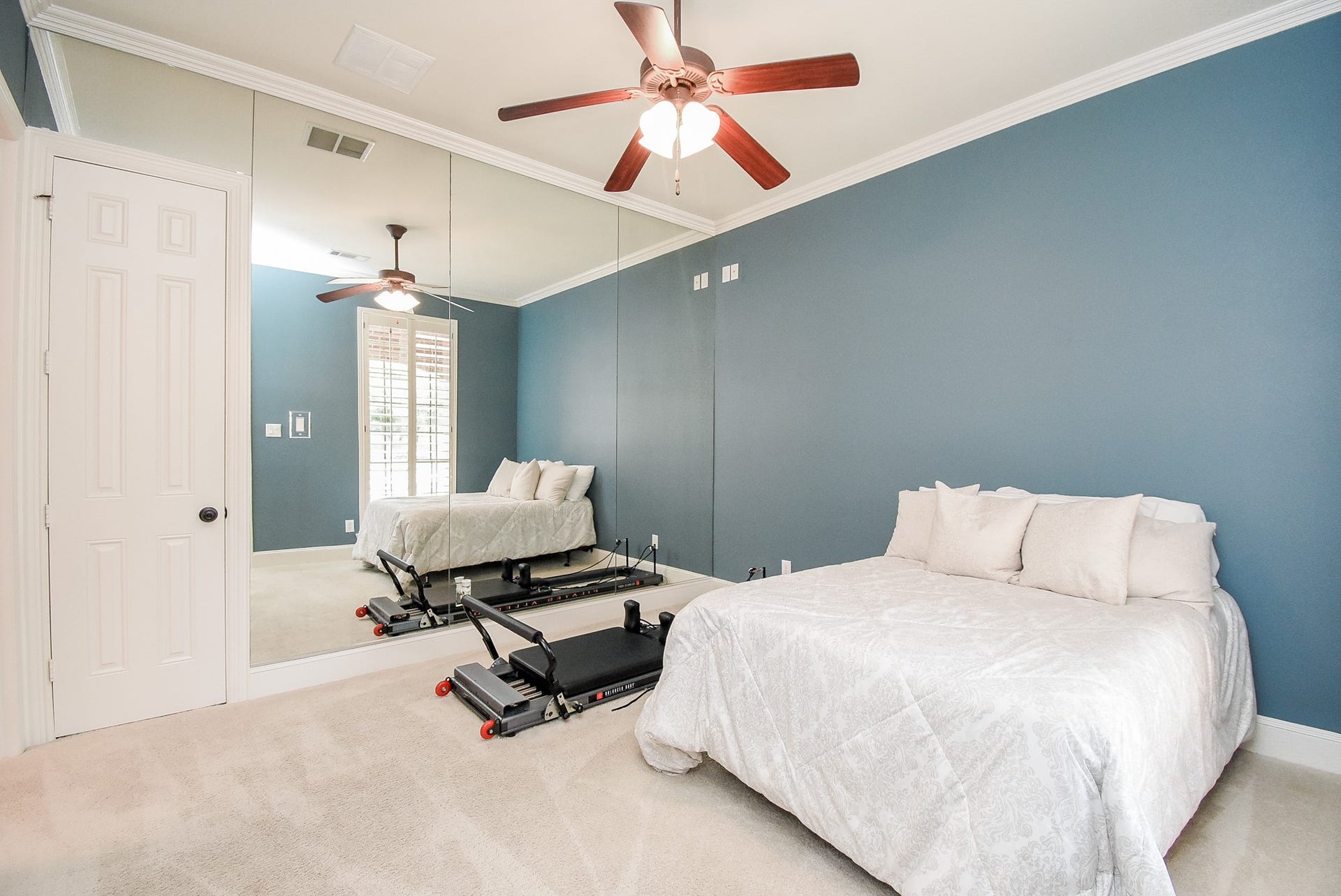 The secondary bedroom down has an ensuite and is perfect for guests, a gym, nursery or generational families. 
Split plan provides privacy. Large walk in closet. Crown molding is a nice accent.