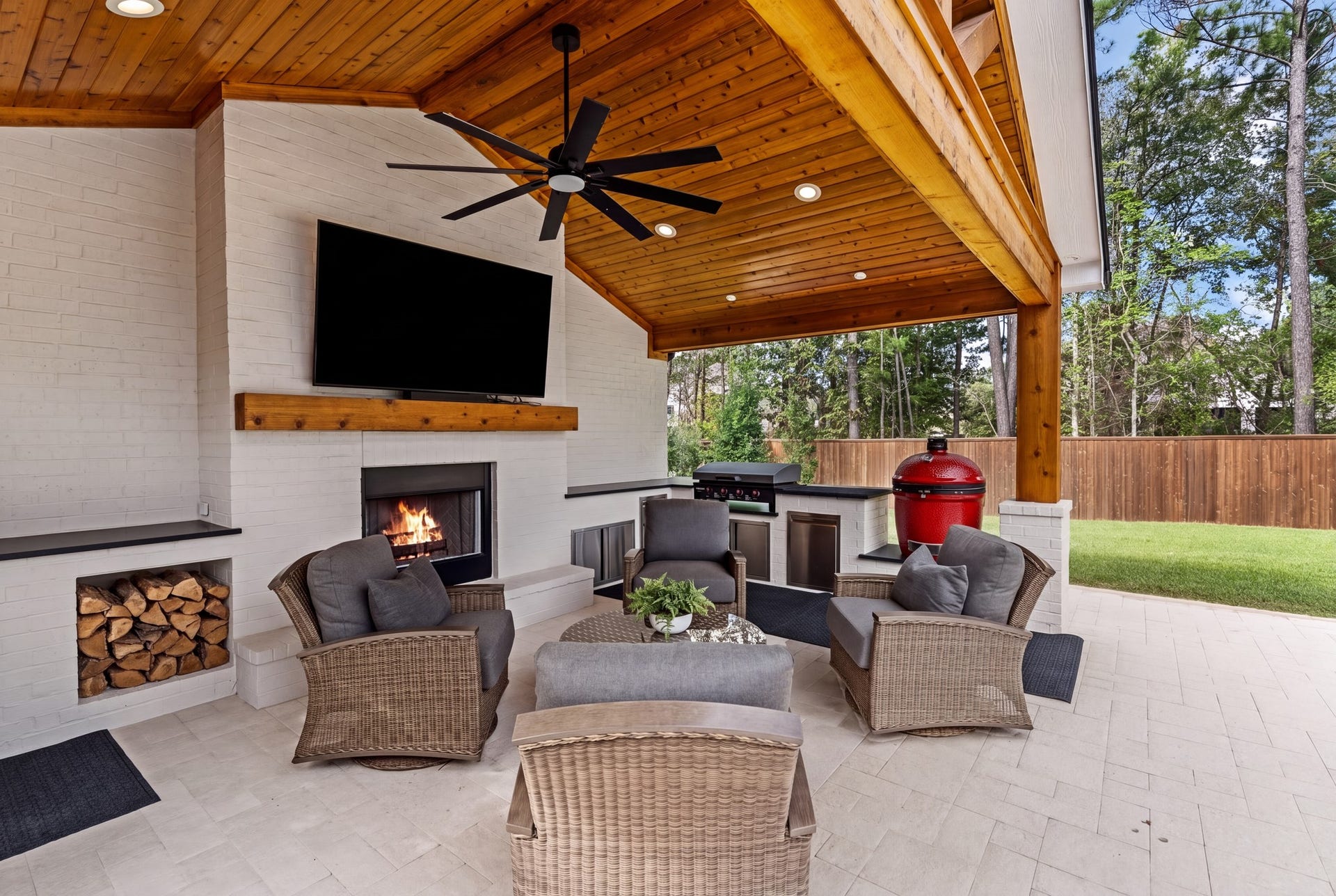 Cozy wood-burning fireplace, outdoor television, and fully equipped kitchen w/built-in Blackstone grill and Kamado Joe...all overlooking the heated pool, spa, and private wooded greenbelt--this exceptional cabana offers the ultimate setting for year-round entertaining & relaxation!
