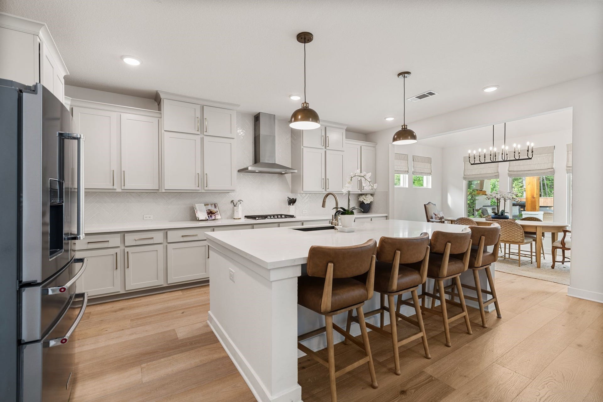 The open-concept design flows seamlessly into the dining area, creating the perfect space for everyday living and entertaining!