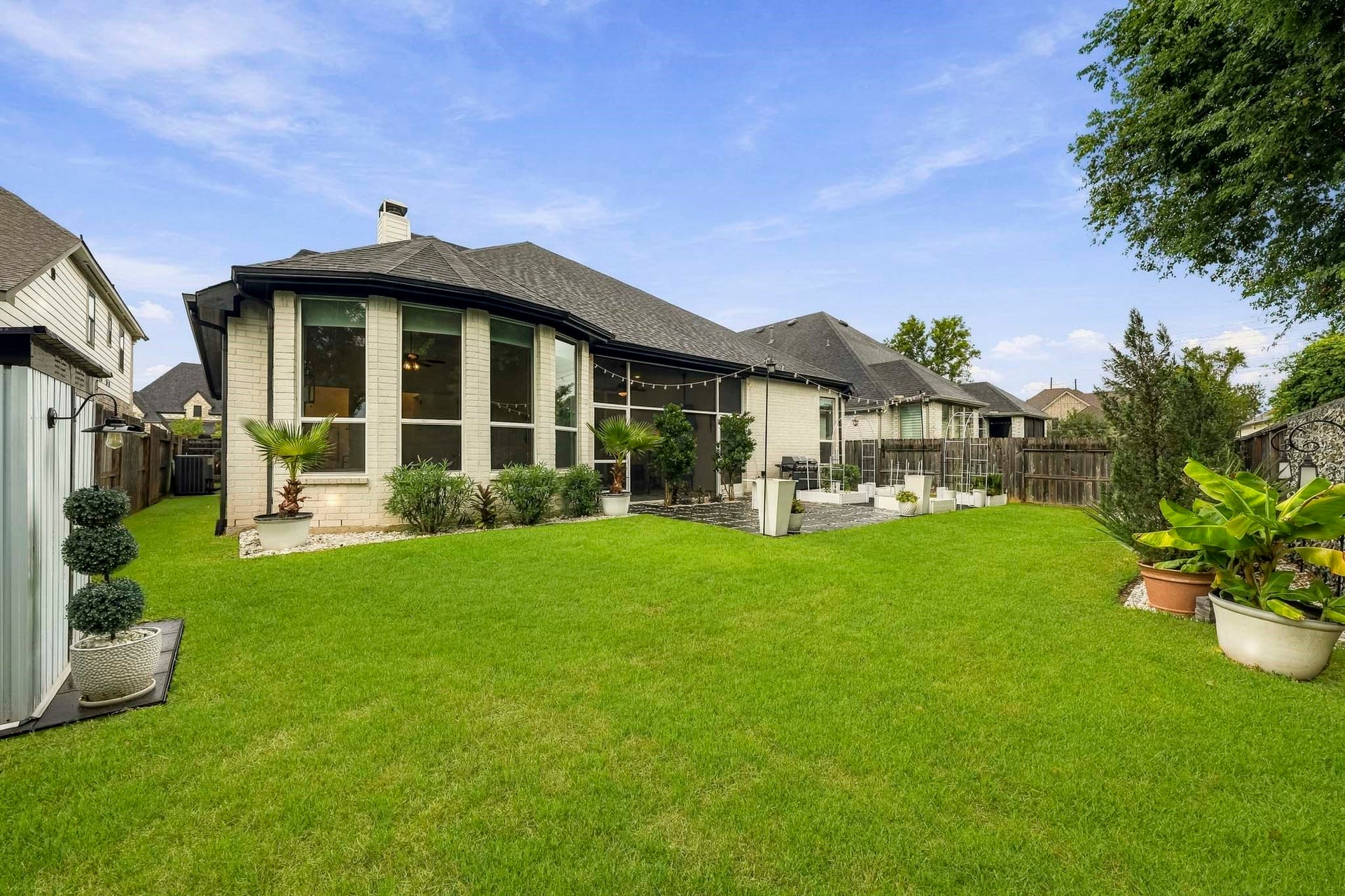 2514 Heritage Park Drive, Missouri City, TX 77459 The back of the home opens to an expansive backyard offering exceptional flexibility, with ample space for a future pool, lush garden retreat or dedicated play area, all enhanced by the peaceful setting and added privacy of the neighboring nature preserve.