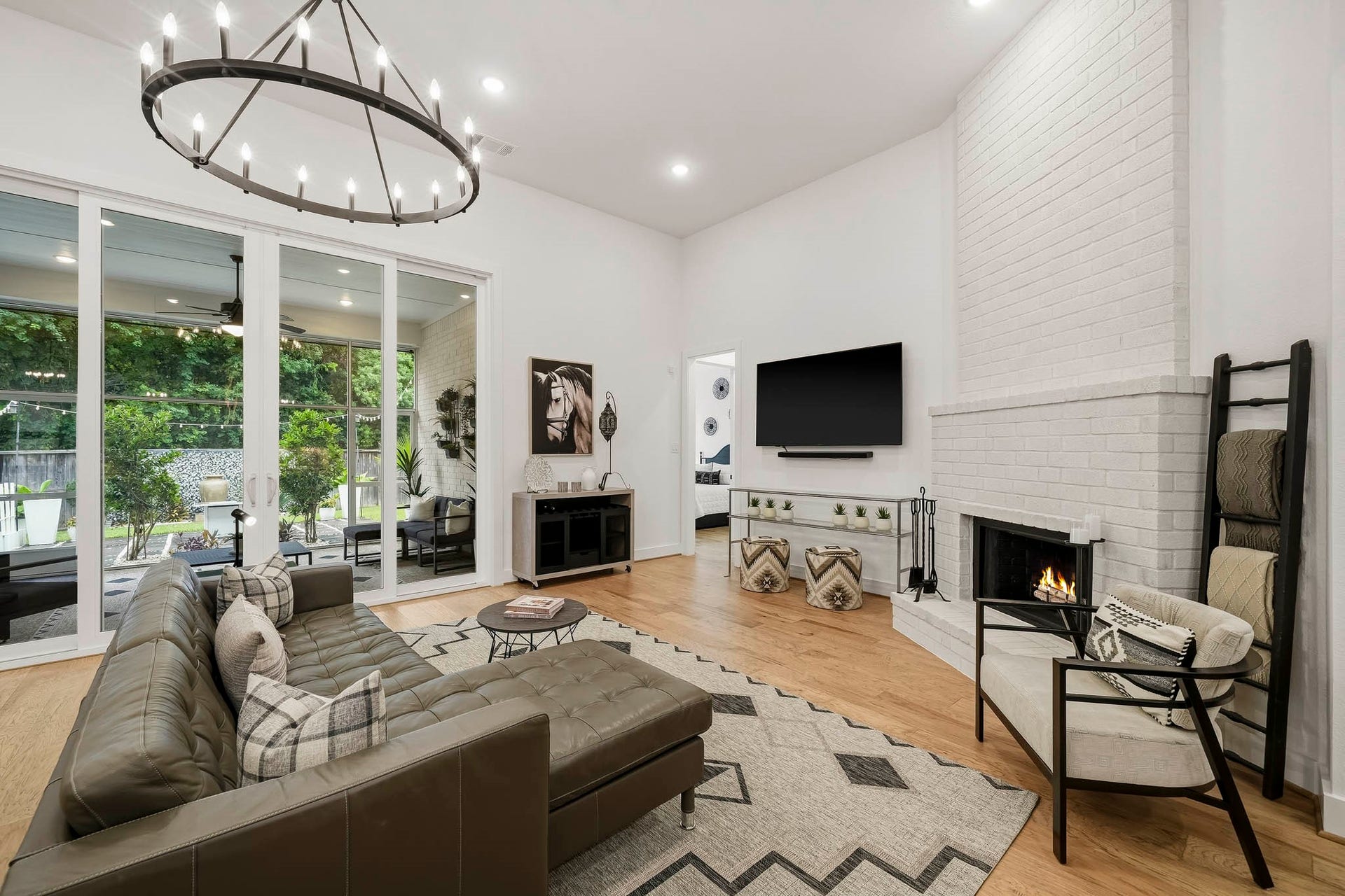 2514 Heritage Park Drive, Missouri City, TX 77459 Step outside through the impressive 12-foot center sliding patio doors to a screened-in porch that extends the living space outdoors and opens to a private backyard retreat, perfect for relaxed evenings or entertaining guests.
