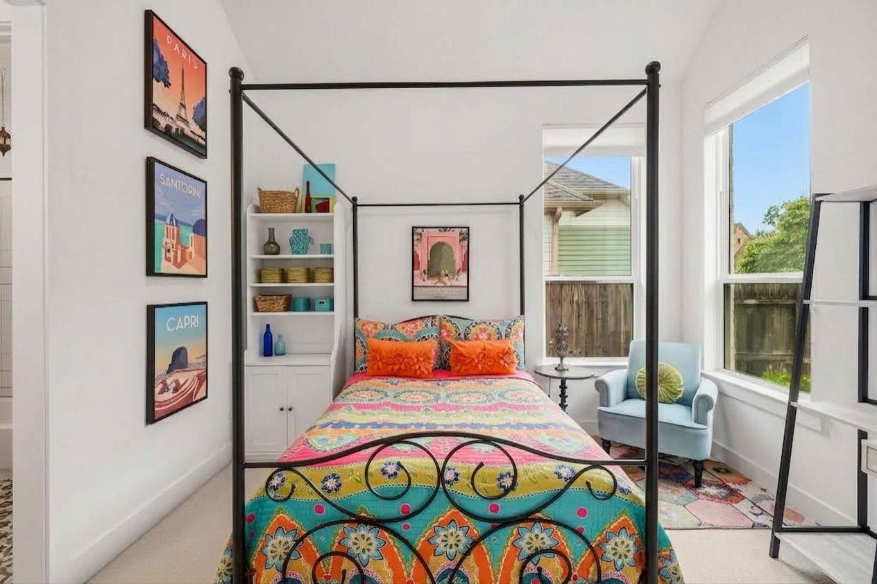 2514 Heritage Park Drive, Missouri City, TX 77459 The fourth bedroom is enhanced by a tray ceiling and window that brings in plenty of natural light, adding architectural interest and a bright, inviting feel to the space.