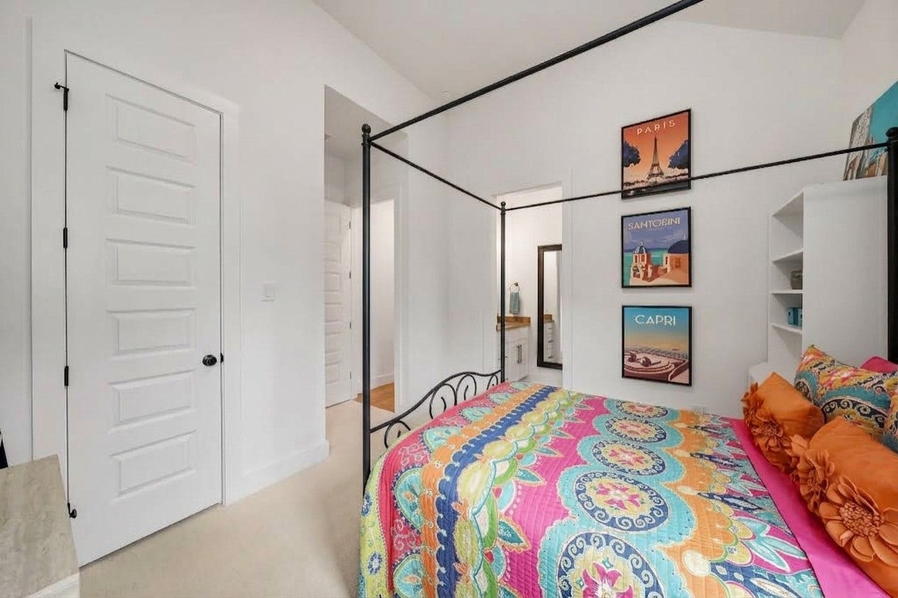 2514 Heritage Park Drive, Missouri City, TX 77459 A ceiling mounted light fixture casts a warm glow, adding charm and character to the room. A walk-in closet sits to the left and entry to its own dressing area is through the door on the right.