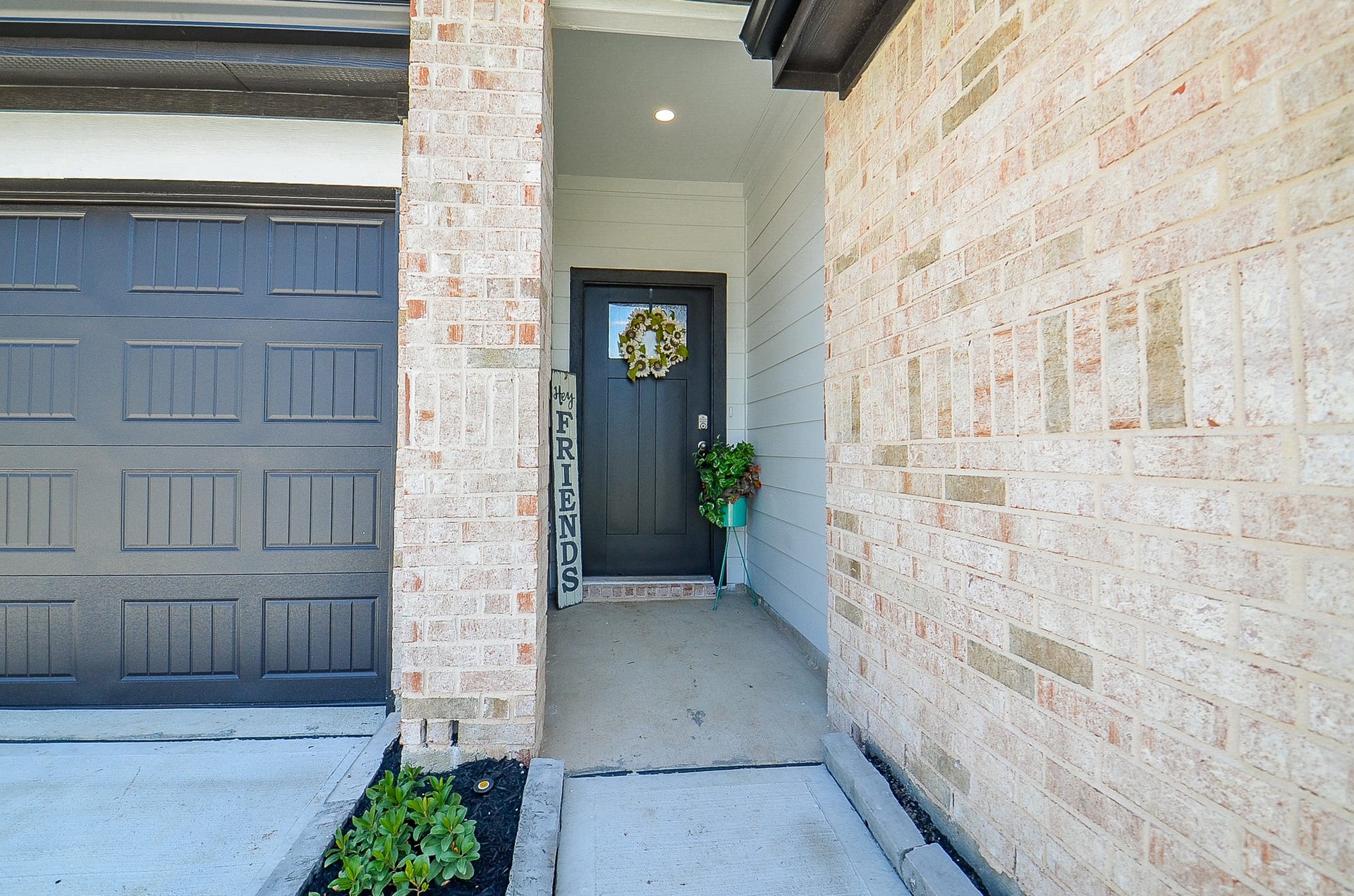 7814 Bel Fiore Drive, Richmond, TX 77406 Charming entryway with a welcoming front door set against a backdrop of elegant brickwork.