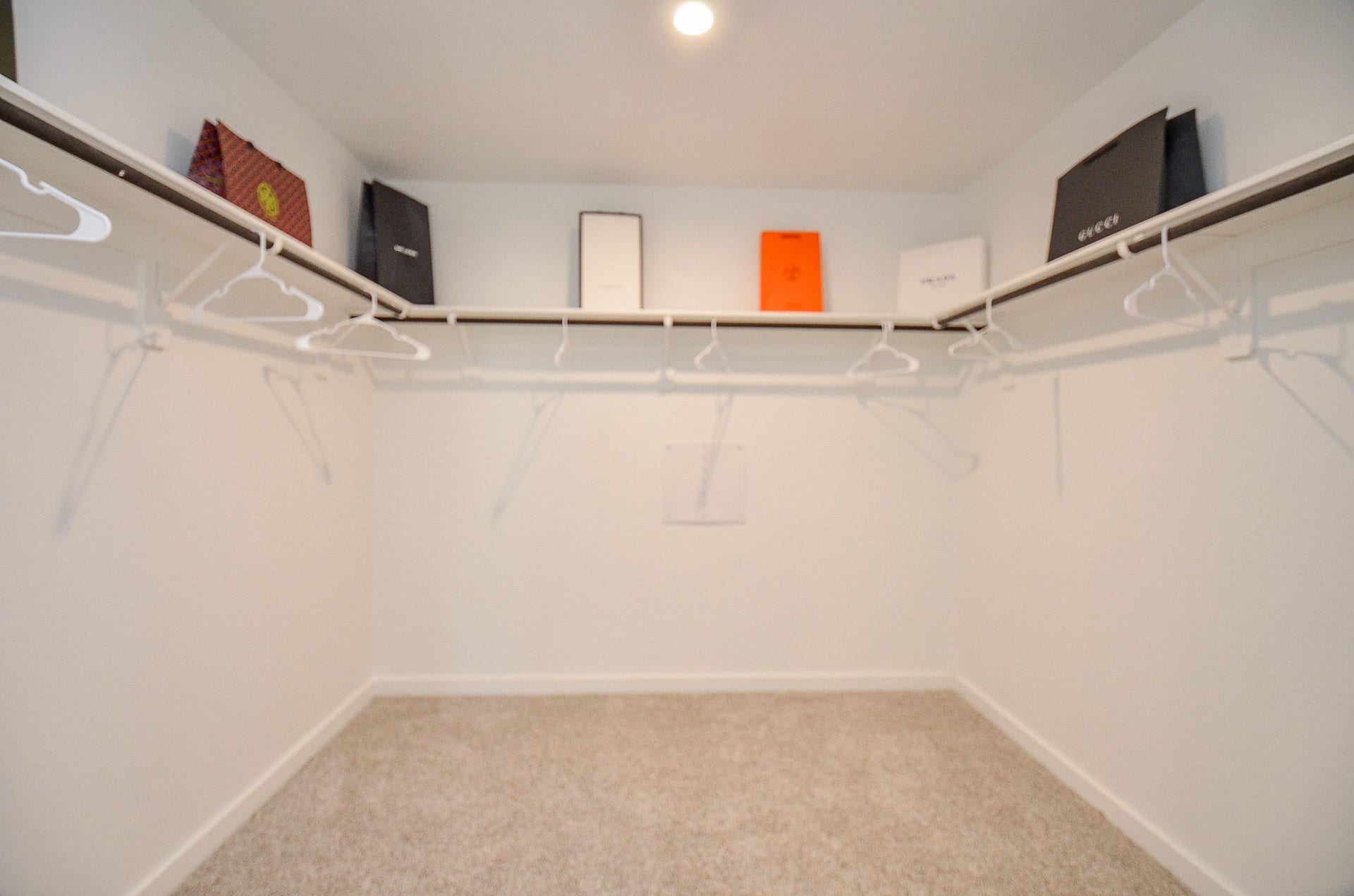 7814 Bel Fiore Drive, Richmond, TX 77406 Spacious walk-in closet with ample shelving and hanging space, perfect for organizing your wardrobe.