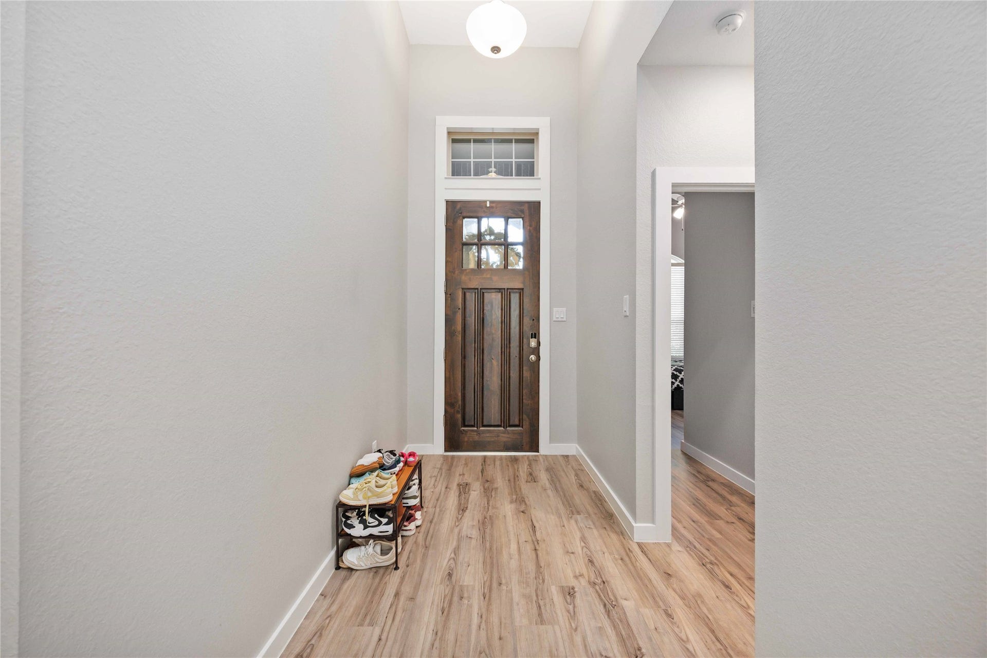 12610 Woodbourne Forest Drive, Humble, TX 77346 Welcome home to this inviting entryway, setting the perfect tone for warmth and style.