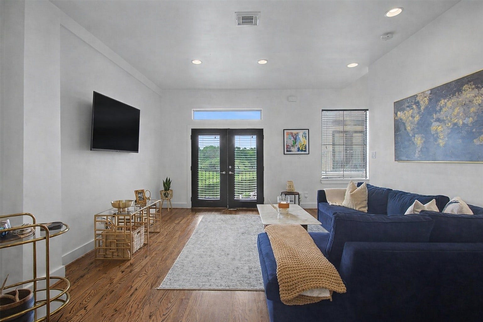 125 E 2nd Street, Houston, TX 77007 A view of the family room leading out to a private patio that overlooks White Oak trails.