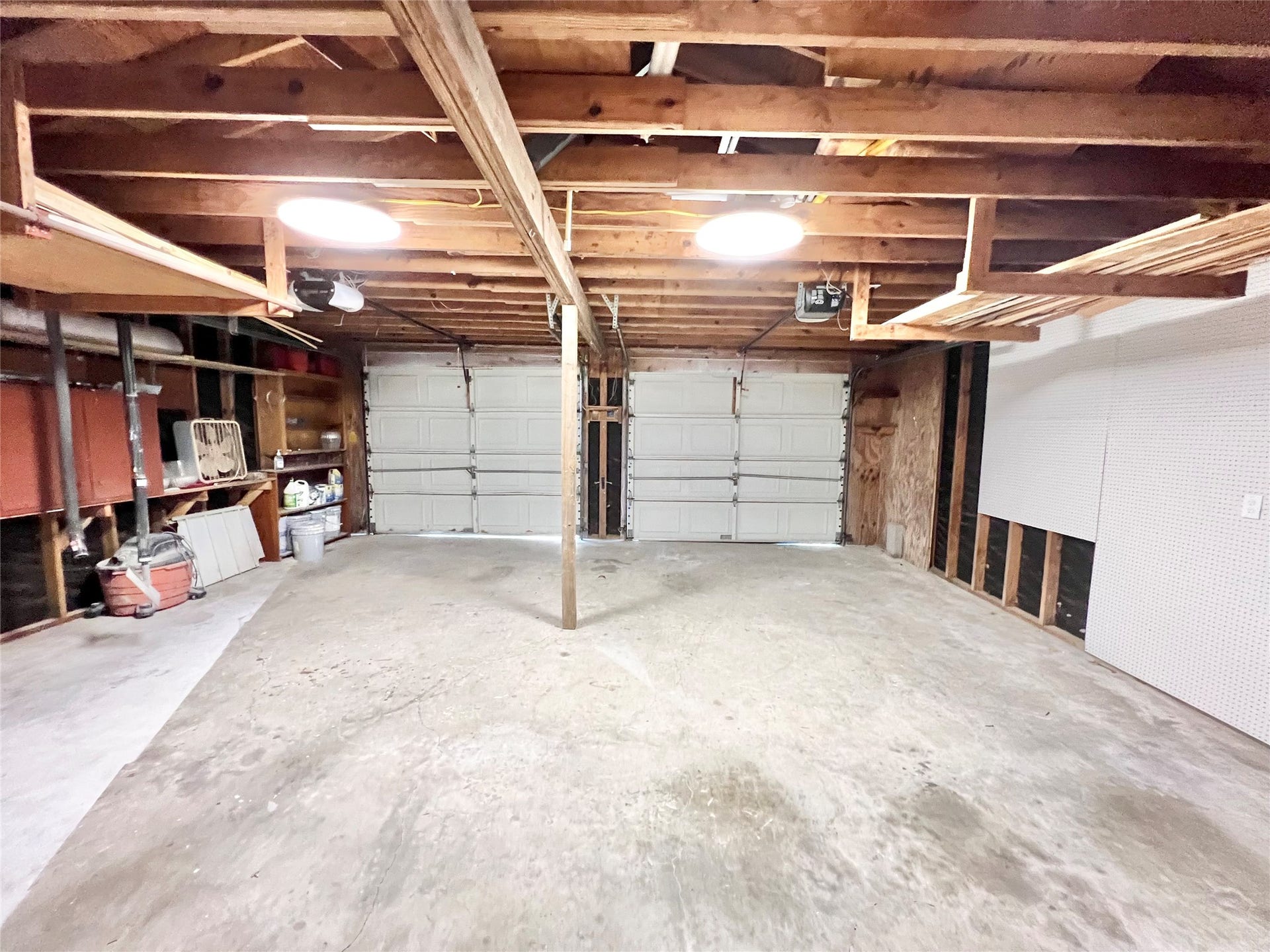 3806 Peck Street, Santa Fe, TX 77517 Auto garage door openers on both bays, peg boards galore to hang all your tools. Park your boat, side by side, four wheelers and additional vehicles here!