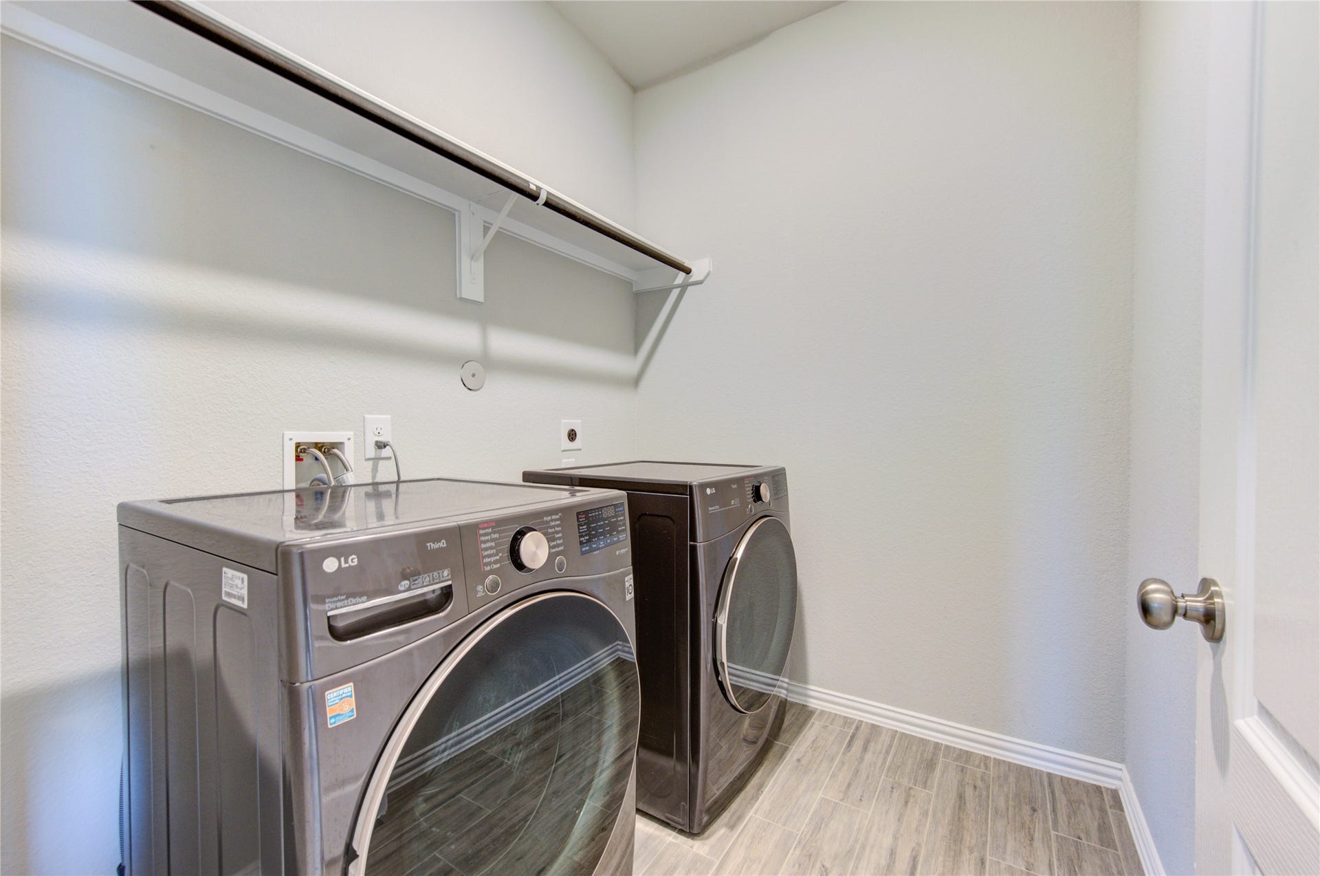 Spacious laundry room with washer and dryer included and plenty of space for storage