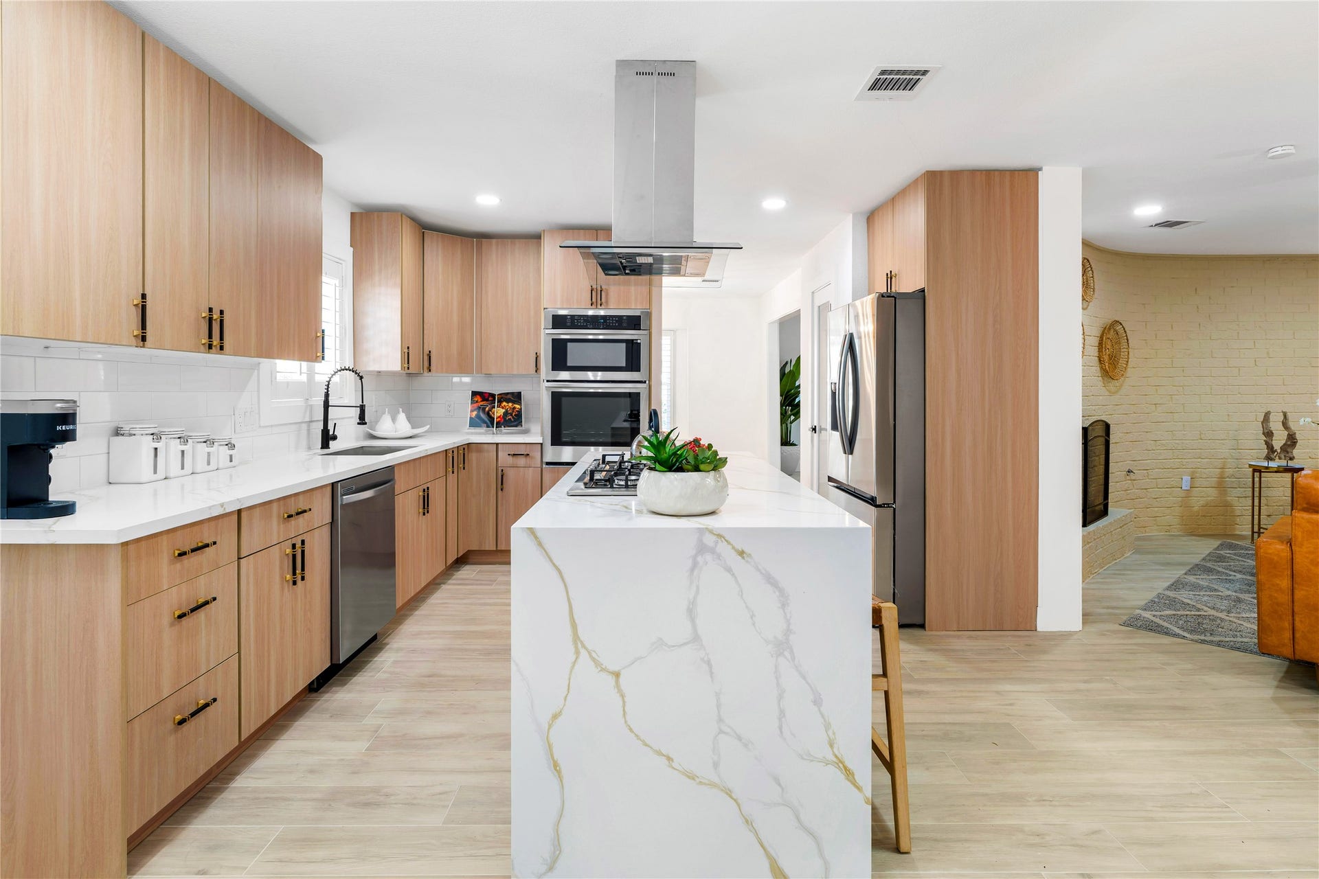 6203 Cheena Drive, Houston, TX 77096 Bright and spacious kitchen with ample storage, counter space, and an open connection to the living area.