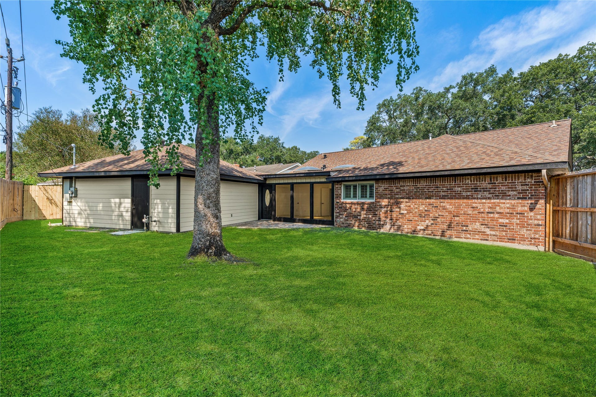 6203 Cheena Drive, Houston, TX 77096 Spacious backyard with plenty of green space and room to enjoy the outdoors.