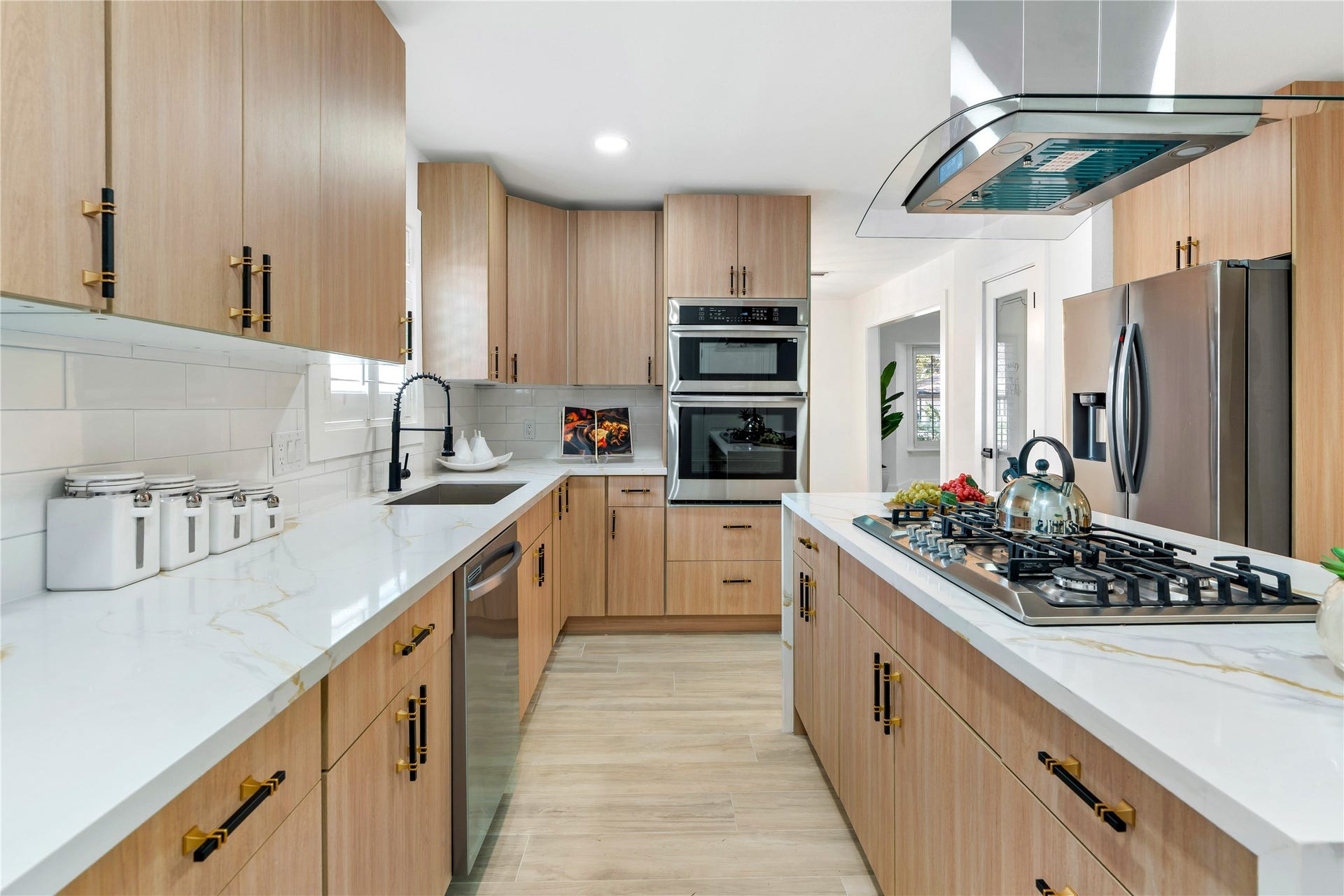 6203 Cheena Drive, Houston, TX 77096 Bright kitchen with ample cabinetry, generous counter space, and a practical layout.