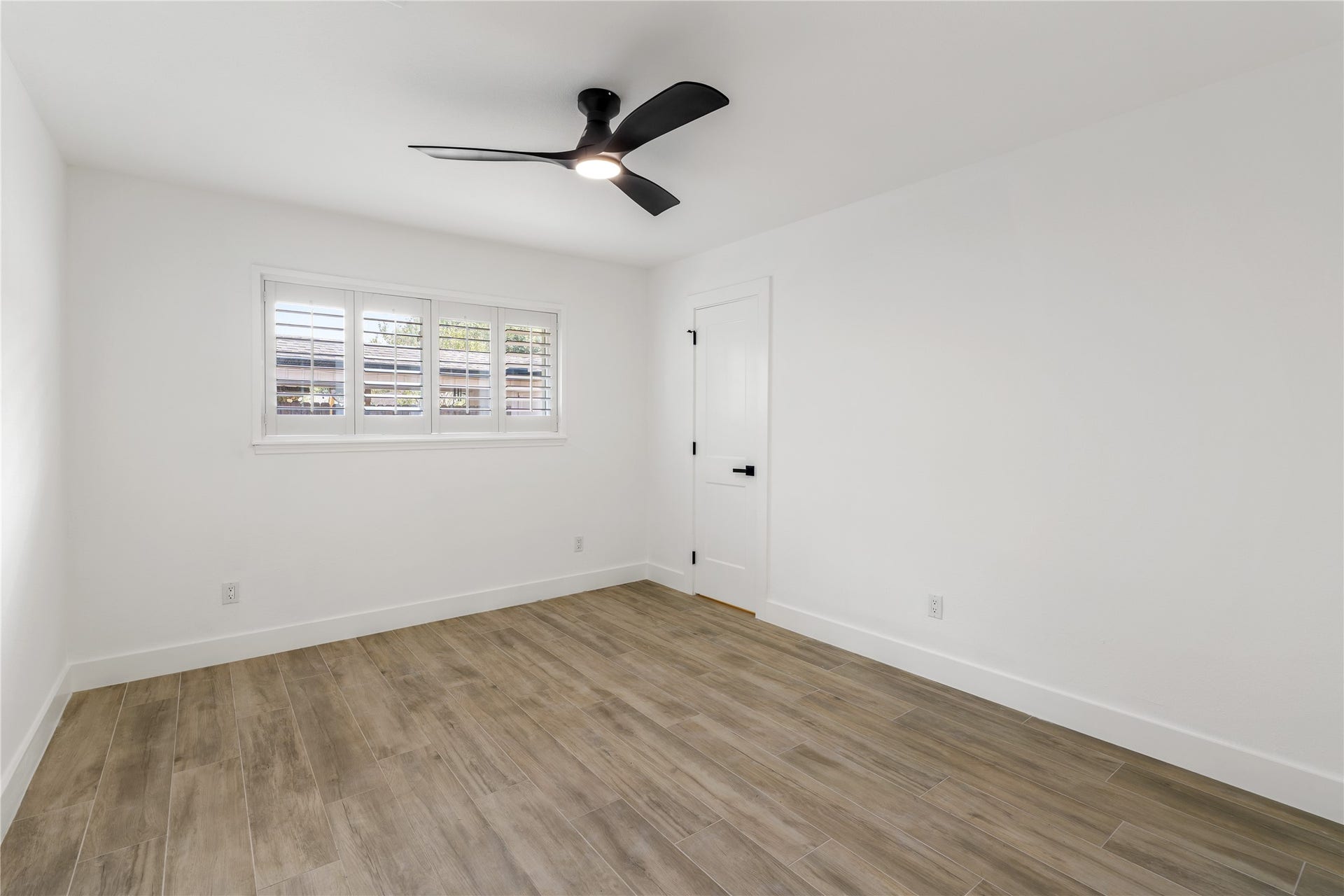 6203 Cheena Drive, Houston, TX 77096 Bright bedroom with tile flooring, a ceiling fan, and natural light.