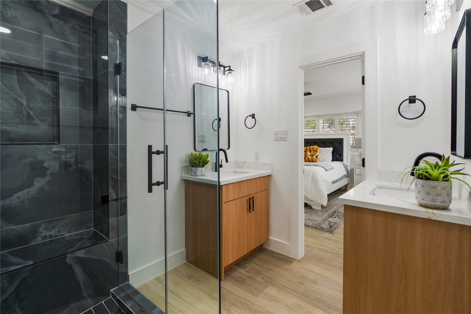 6203 Cheena Drive, Houston, TX 77096 Updated primary bathroom with a glass-enclosed shower, dual vanity, and a clean, modern design.