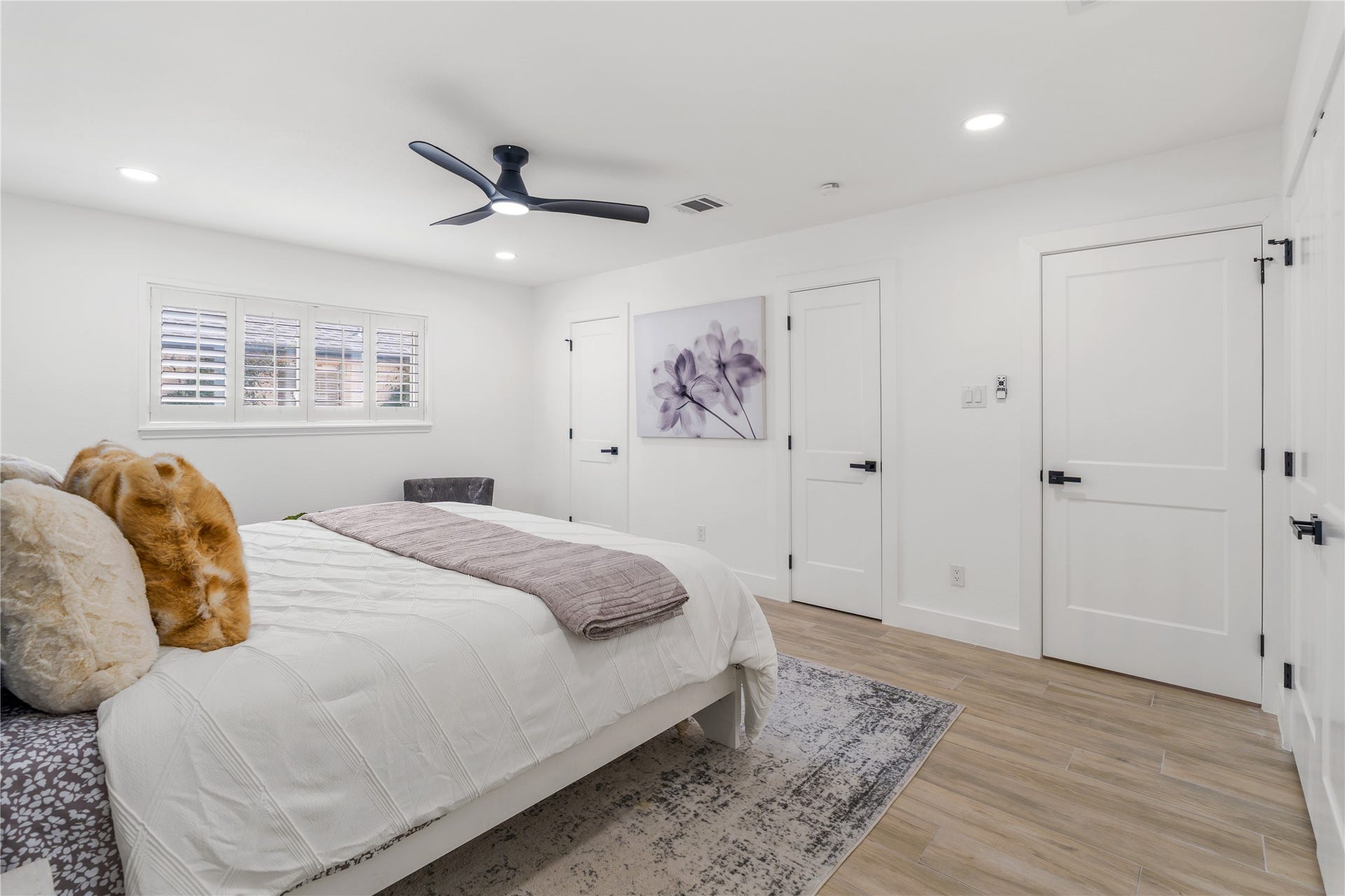 6203 Cheena Drive, Houston, TX 77096 Well-sized primary bedroom with tile flooring, a ceiling fan, and a clean, open feel.