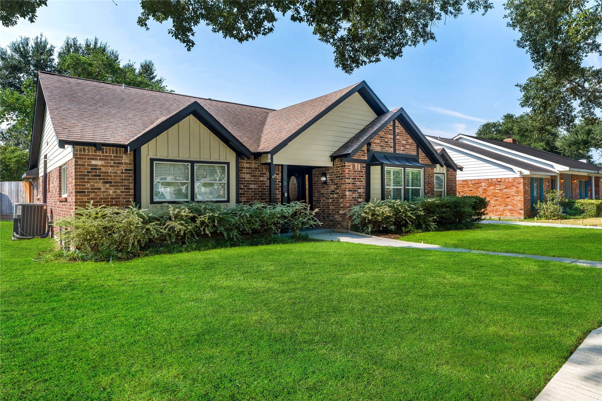 6203 Cheena Drive, Houston, TX 77096 Beautiful exterior view showcasing the homes welcoming entrance and landscaped front yard.
