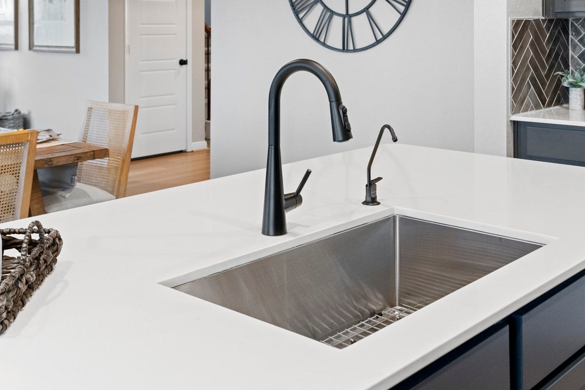 2019 Ardani Lane, Fresno, TX 77545 The self-rimming single bowl kitchen sink is featured here with Moen Sleek kitchen faucet in a matte black.