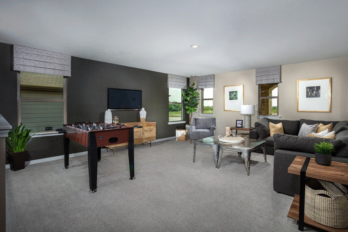 2019 Ardani Lane, Fresno, TX 77545 This vibrant upstairs game room is the ultimate entertainment escape, packed with everything from a classic foosball table to a cozy lounge area. Perfect for rainy days or late-night match-ups, it seamlessly blends friendly competition with total relaxation.