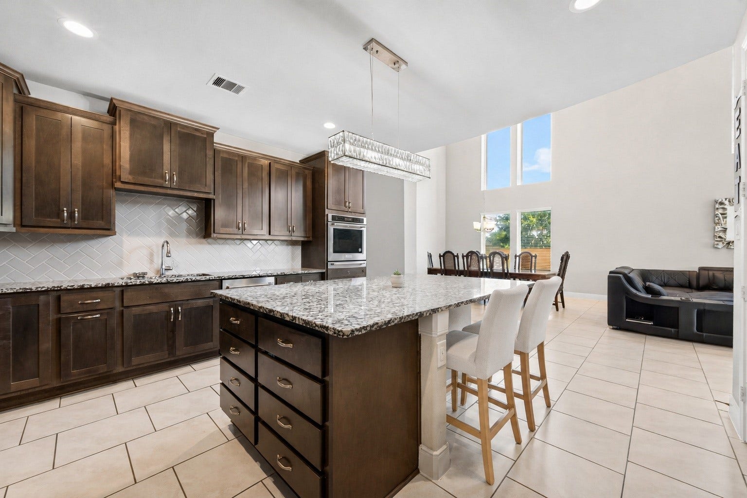 3514 Hampton Landing Court, Katy, TX 77494 Extra large island can sit 6, open to the living room. The center of this upgraded kitchen does not disappoint.