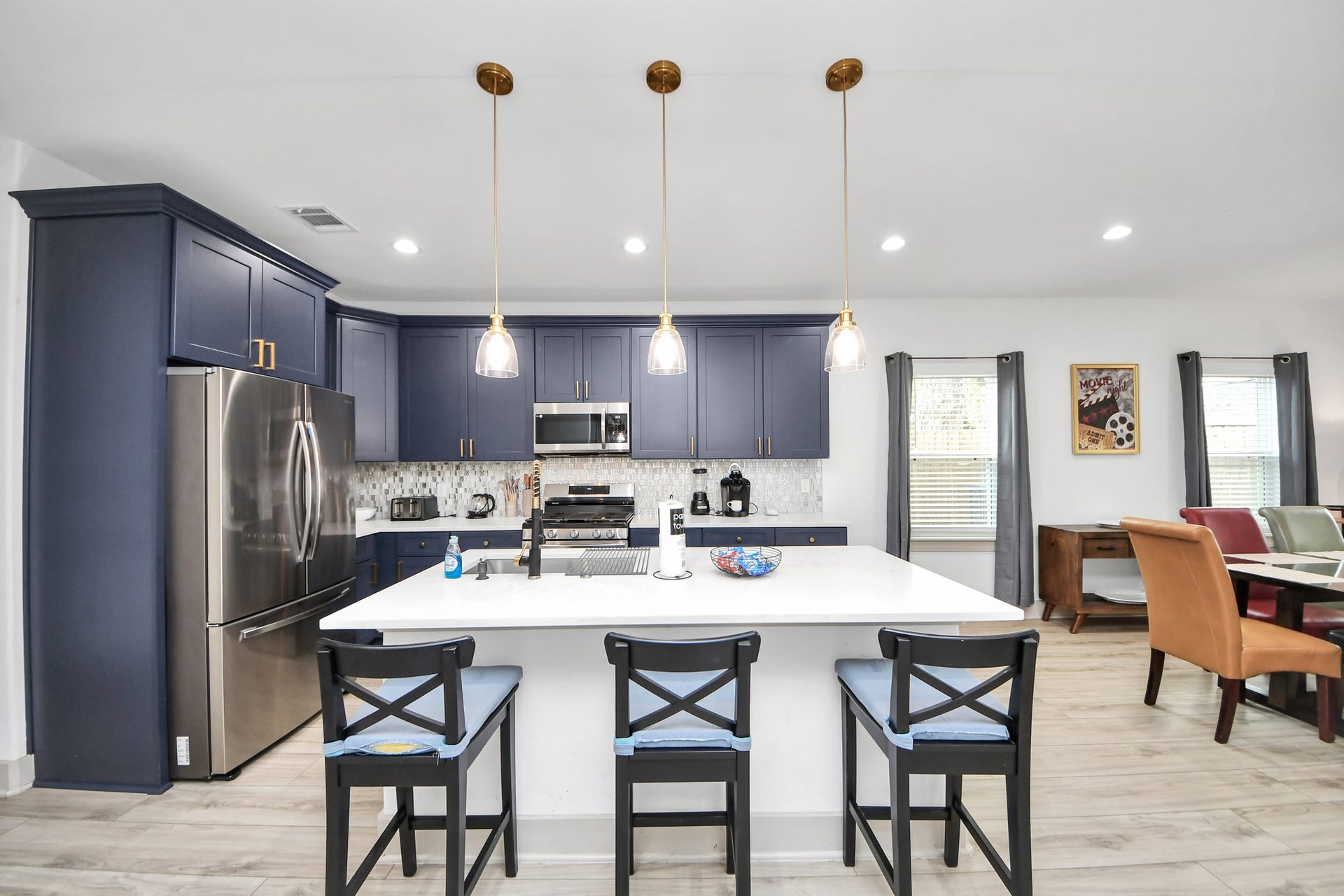 837 W Little York Road, Houston, TX 77091 Modern Houston duplex kitchen featuring generous counter space, stylish cabinetry, stainless appliances, and an oversized island.