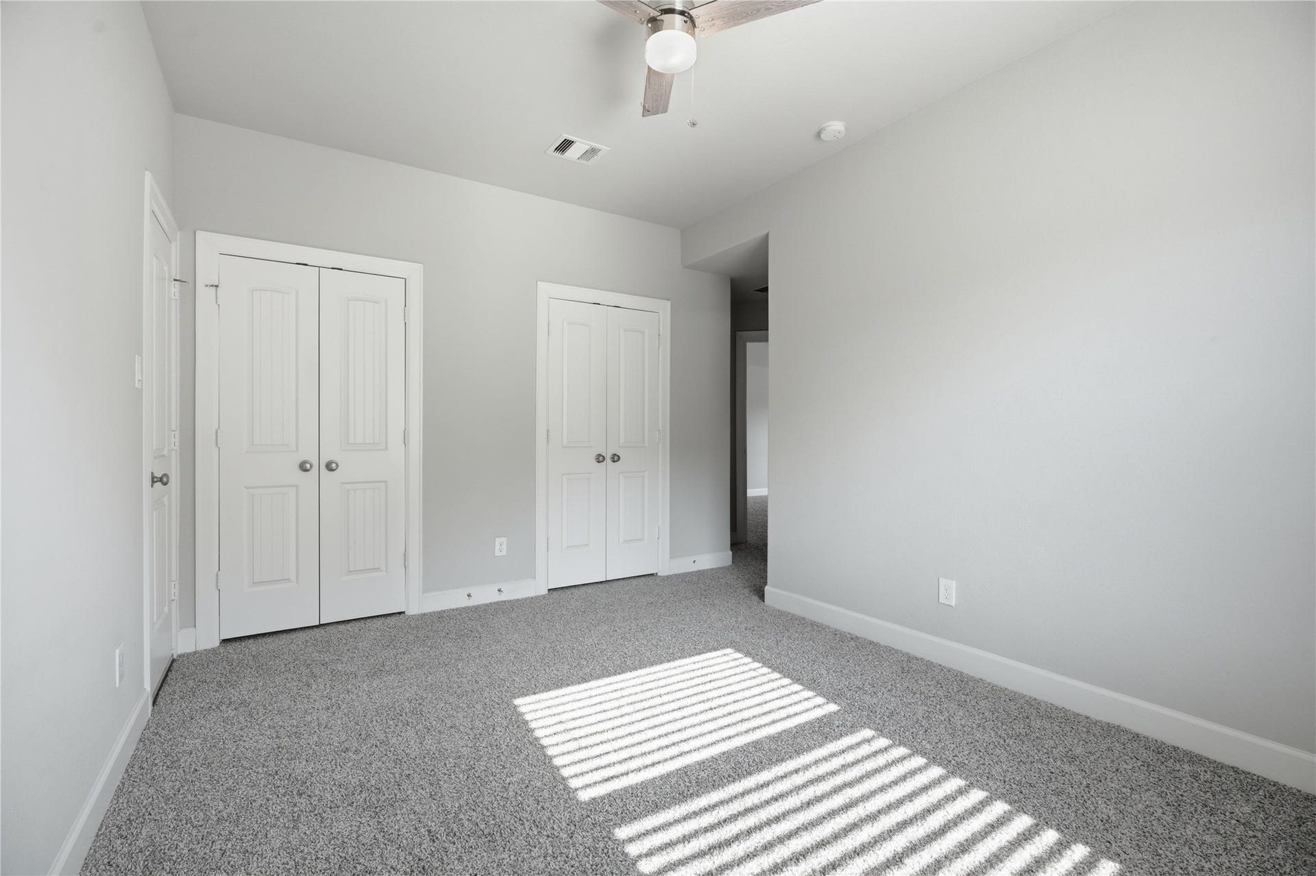 1717 Oakdale Mist Drive, Dickinson, TX 77539 Spacious secondary bedroom featuring abundant natural light, two closets, and its own private en-suite bathroom.