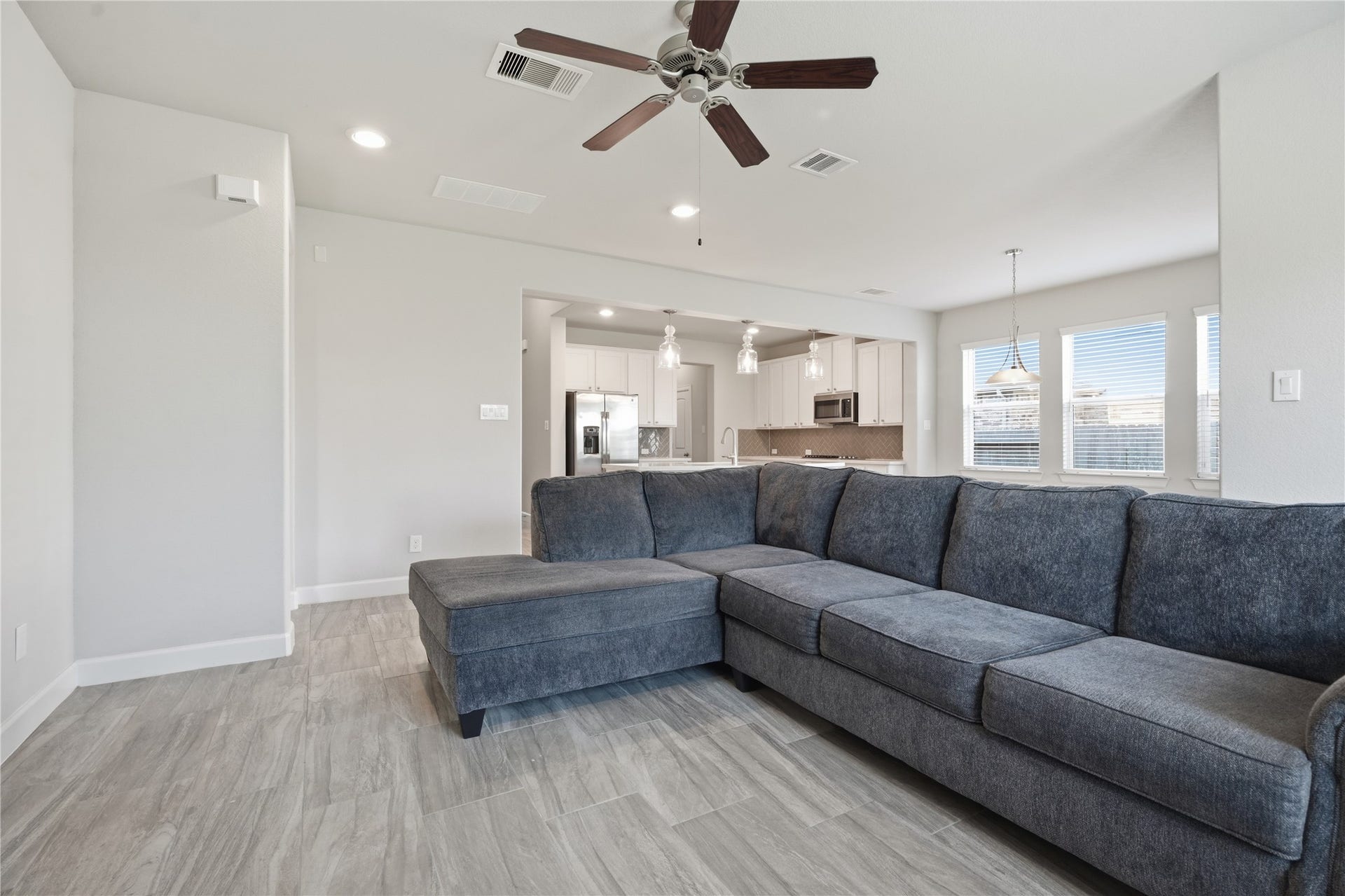 1717 Oakdale Mist Drive, Dickinson, TX 77539 Another view highlights the generous size of the living room and its open connection to the kitchen and breakfast area.