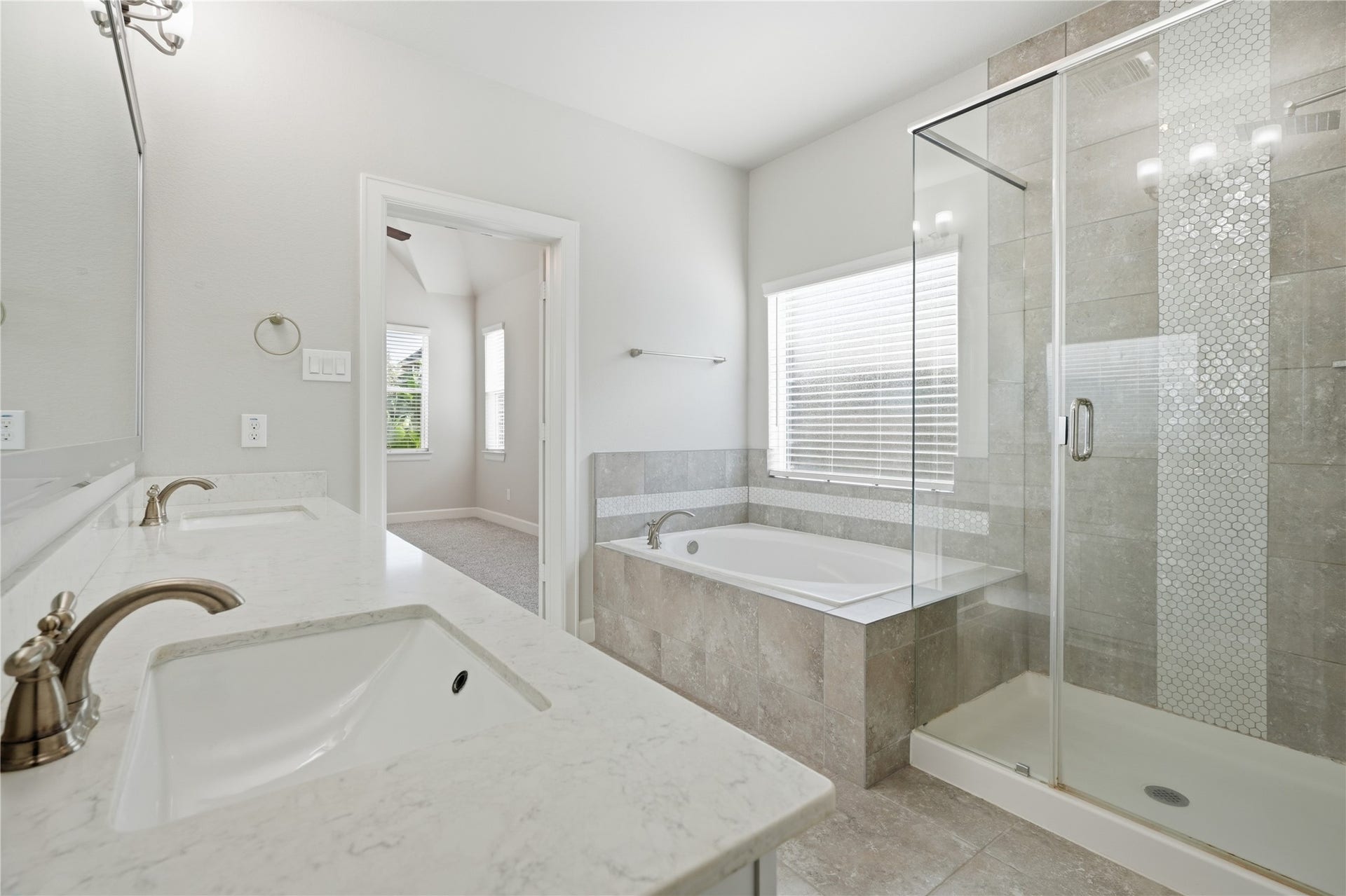 1717 Oakdale Mist Drive, Dickinson, TX 77539 Another view highlights the separate shower and tub, along with the bathrooms spacious layout and neutral finishes.