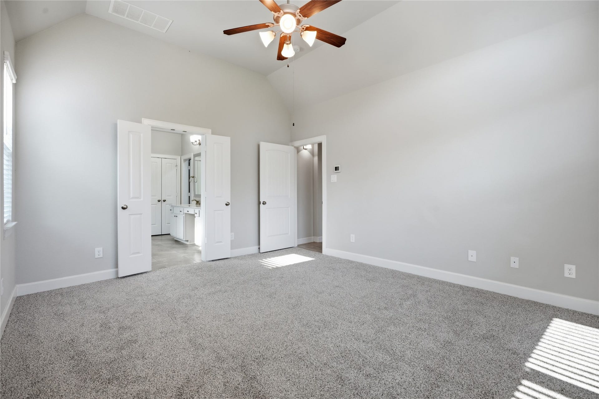 1717 Oakdale Mist Drive, Dickinson, TX 77539 Another view of the primary suite highlights the generous room size and direct access to the private primary bathroom.
