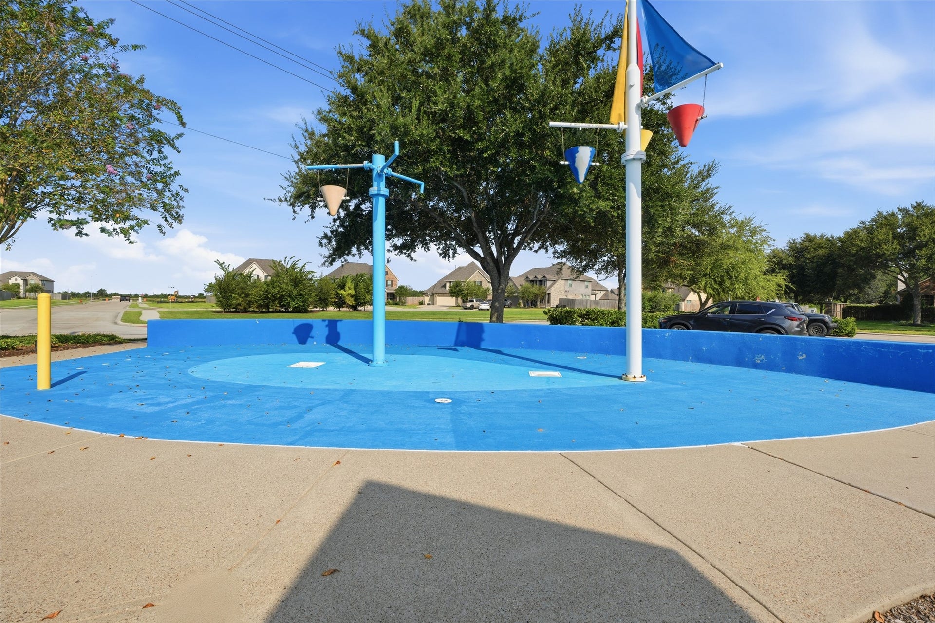 1717 Oakdale Mist Drive, Dickinson, TX 77539 The neighborhood recreation area includes a playground along with a separate splash pad for additional outdoor fun.