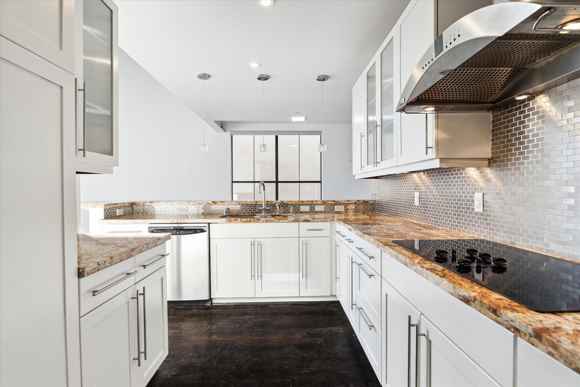 SS appliances, electric cooktop, refrigerator included.