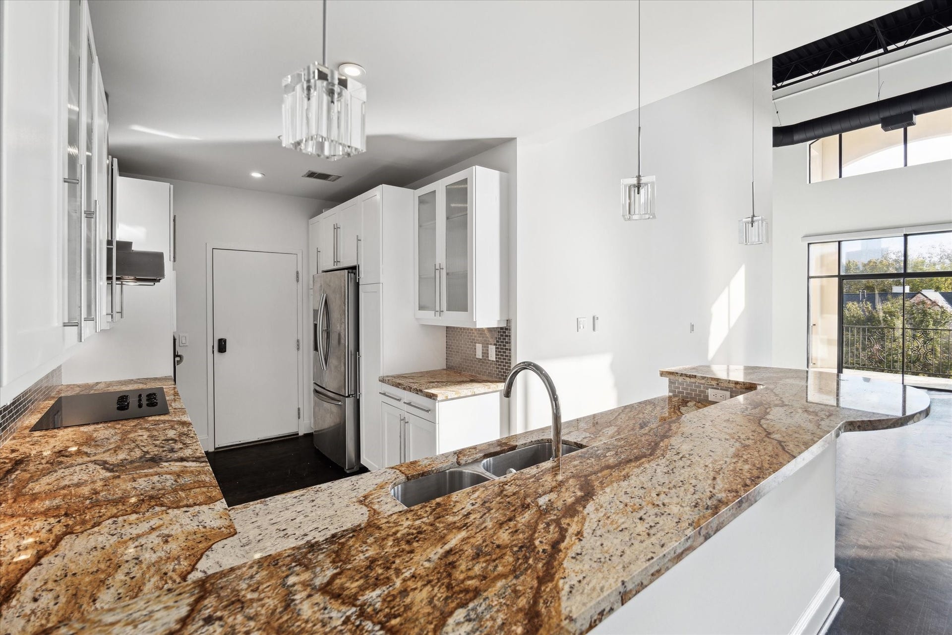 Open kitchen with breakfast bar.